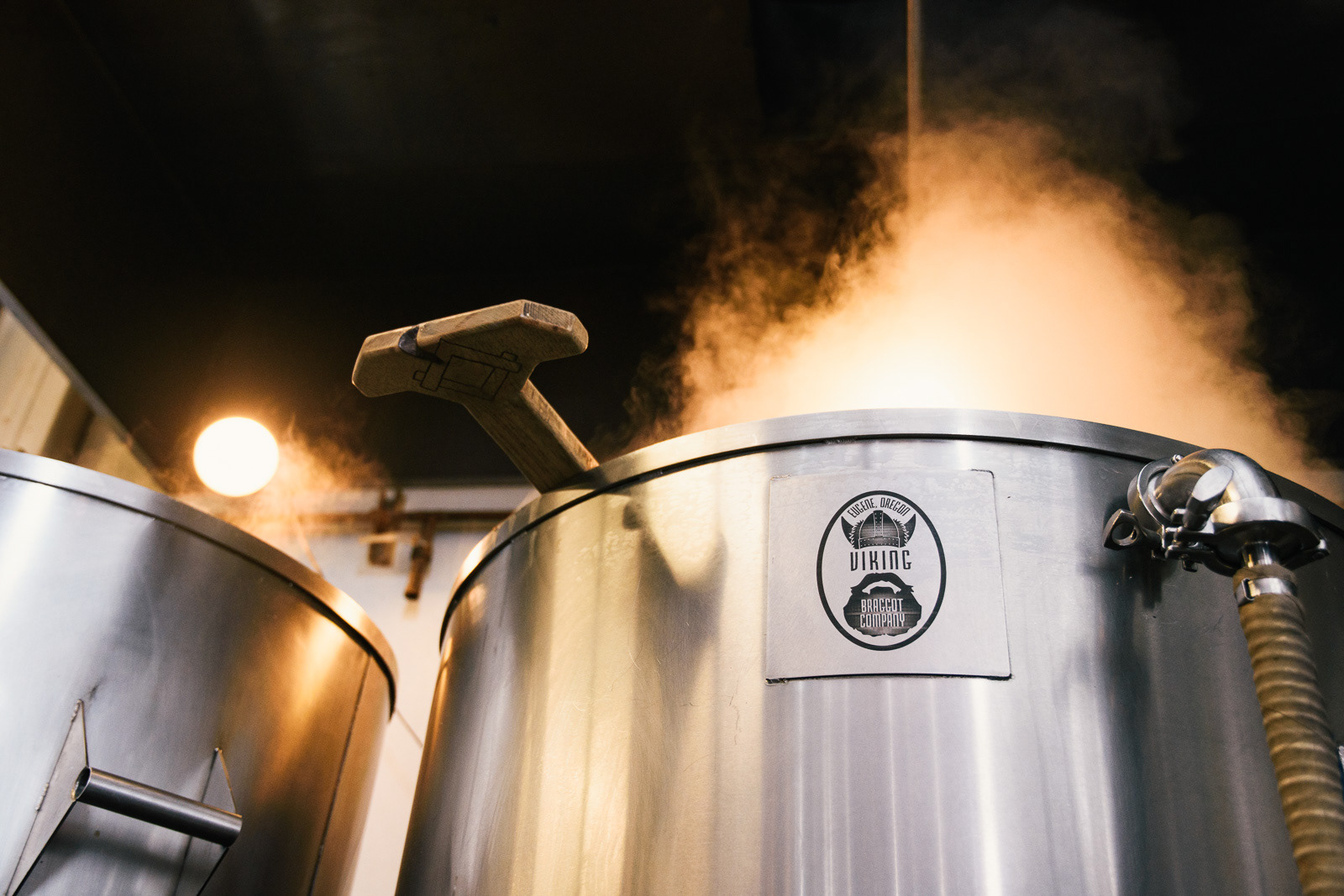 Steam comes out of beer brewing tanks at Viking Braggot Company in Eugene, OR