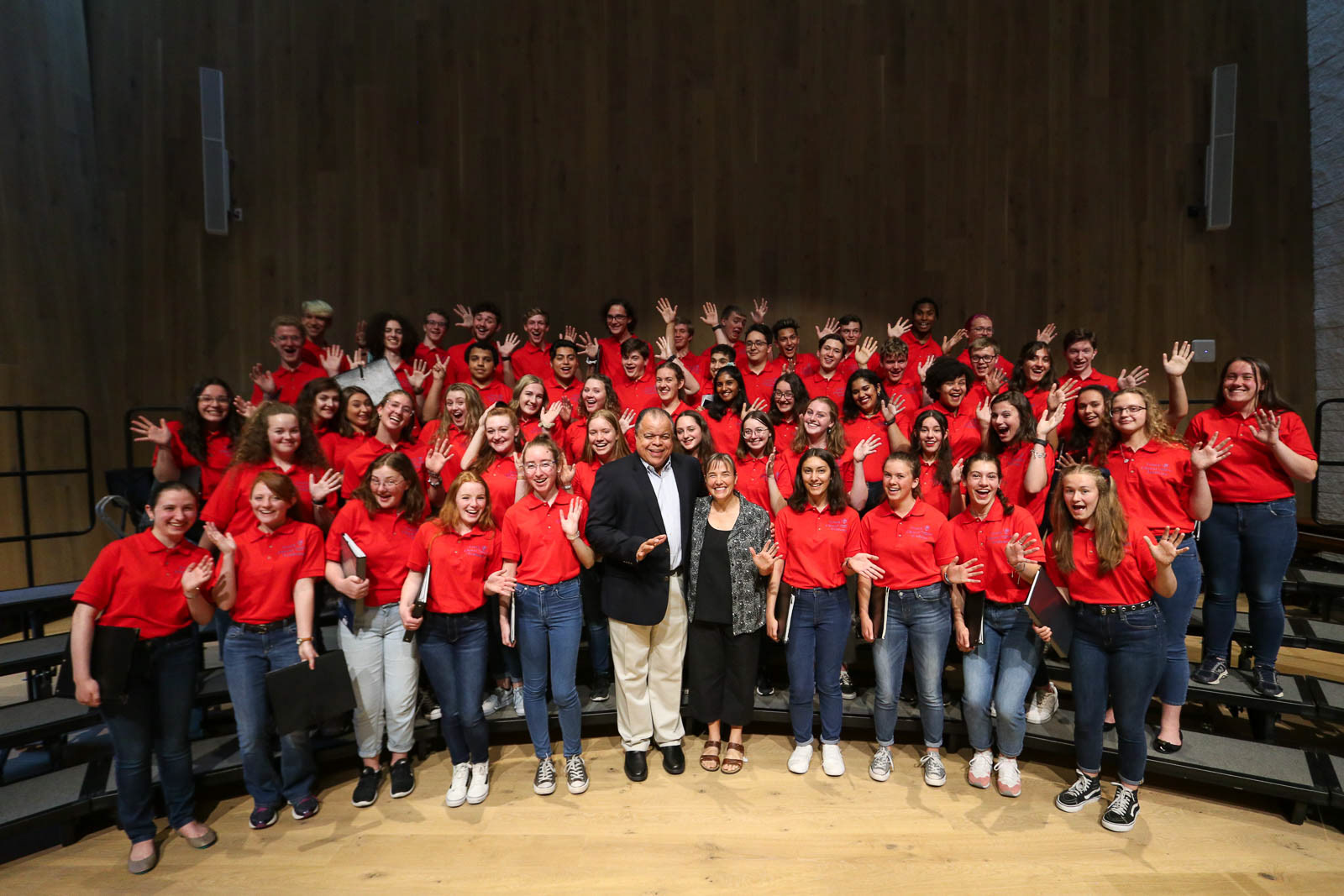 Conductor standing with choir, Oregon Bach Festival youth program