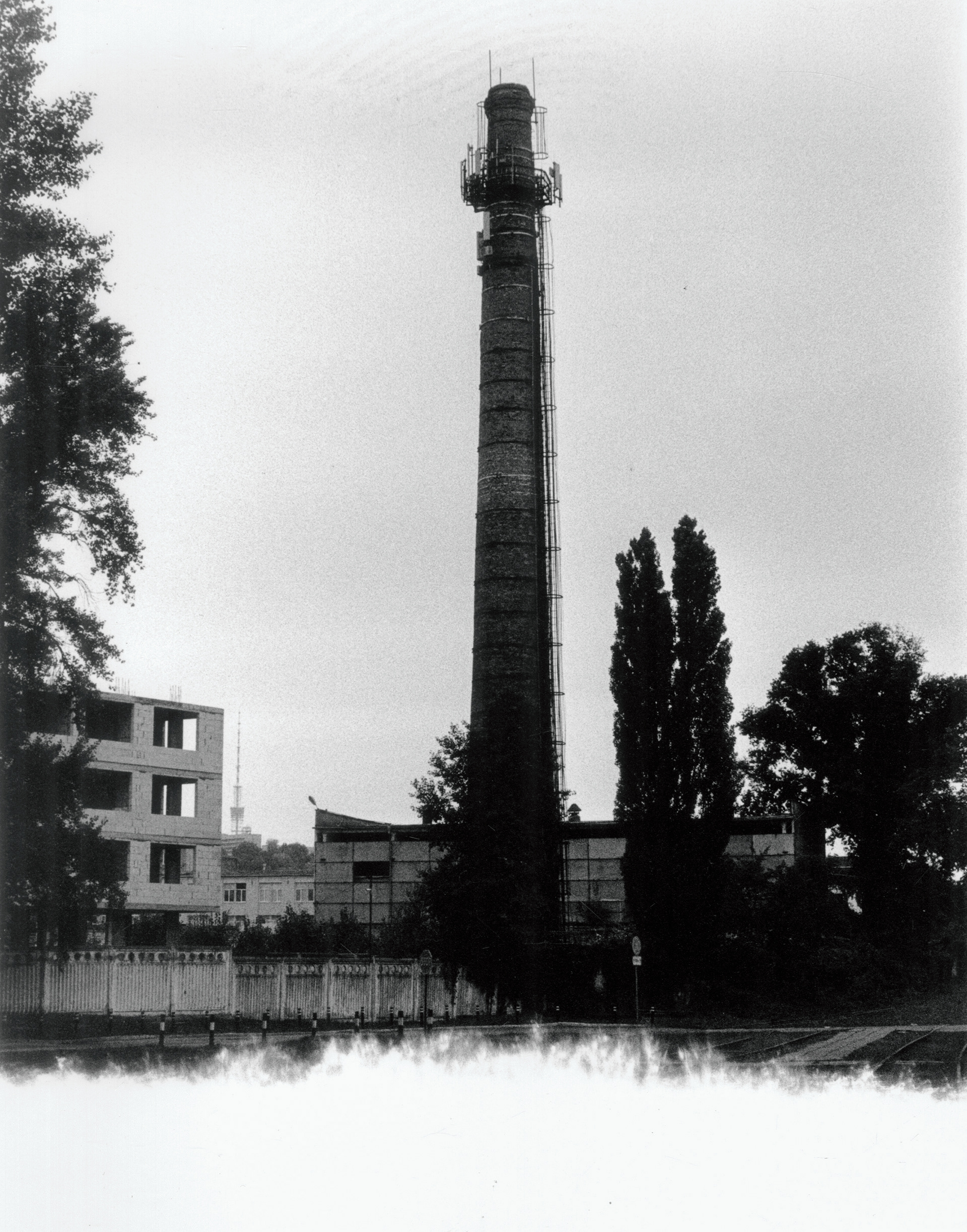 a tall smokestack in Kiev, the bottom of the image is lost to a light-leak