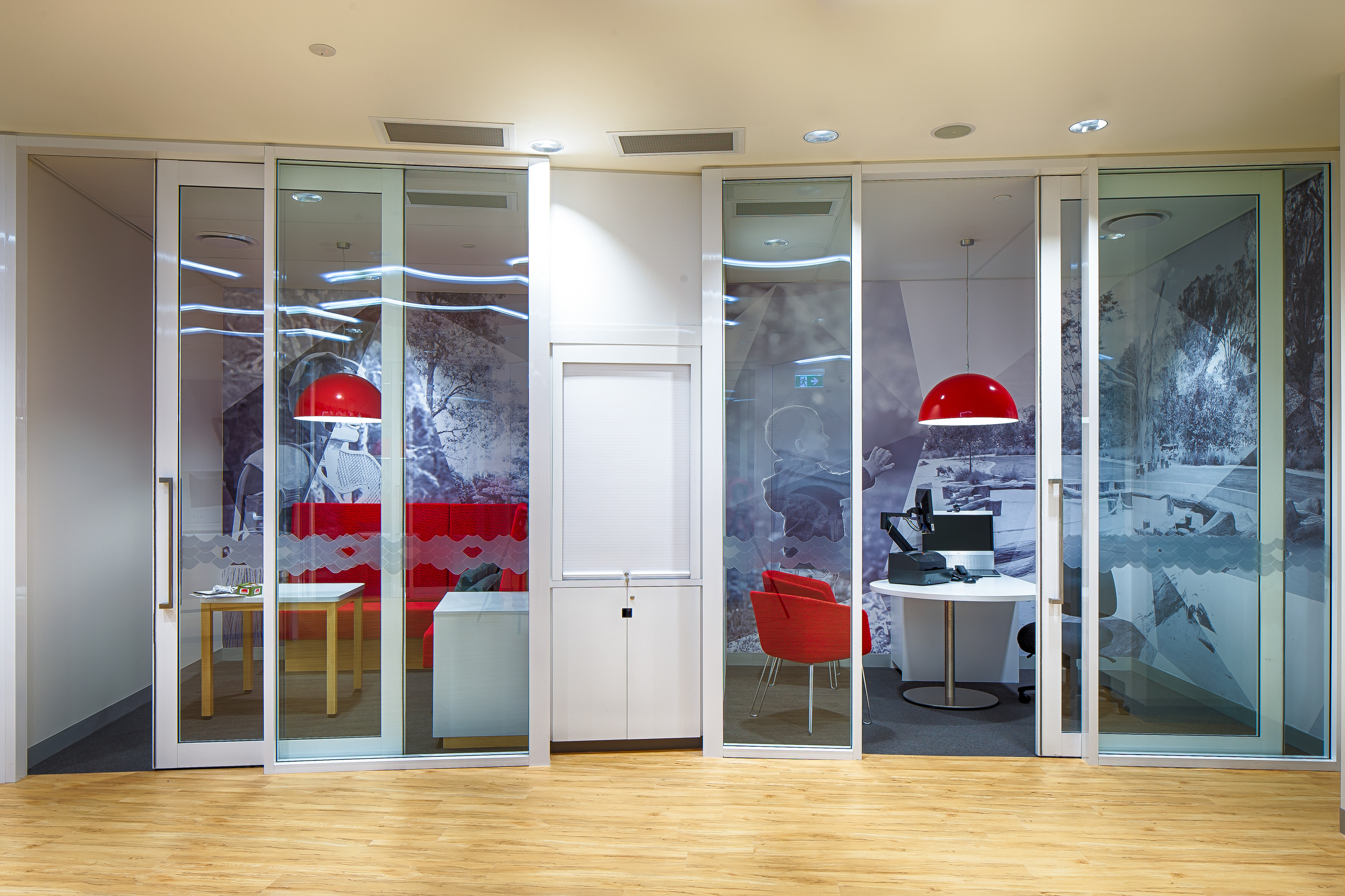 Acoustically private workspaces with corner booth and traditional over the desk configurations