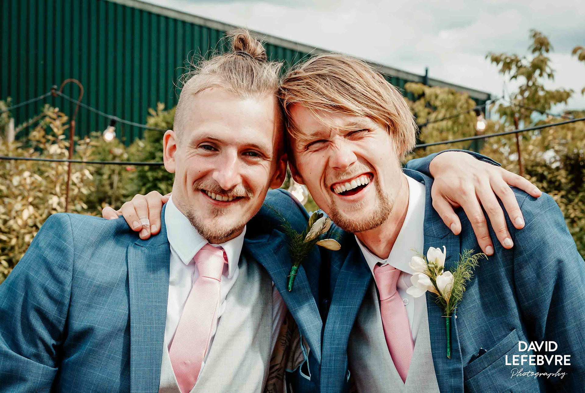 two friends in suits at owen barn house wedding venue