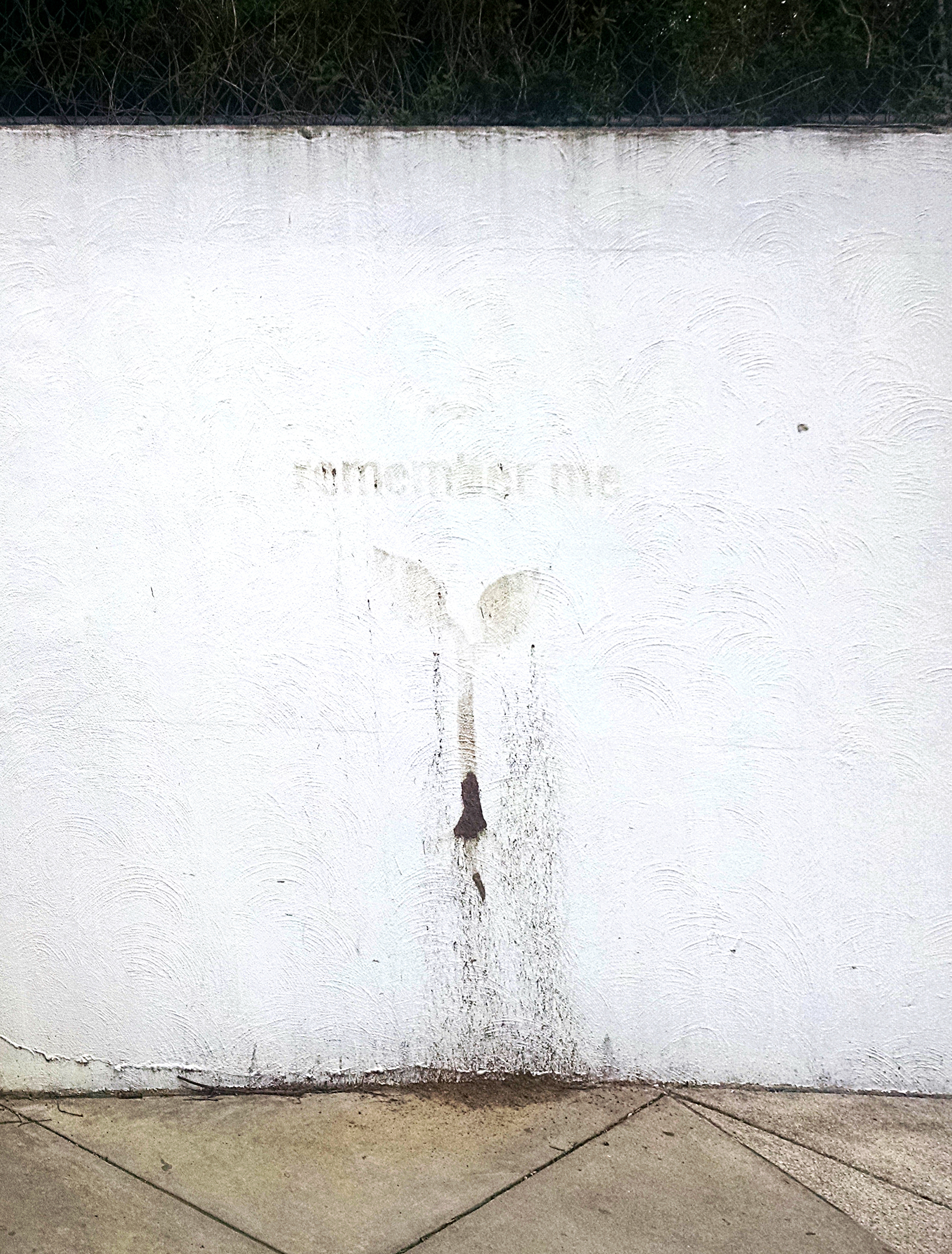 The mud stained the white wall for months to come.