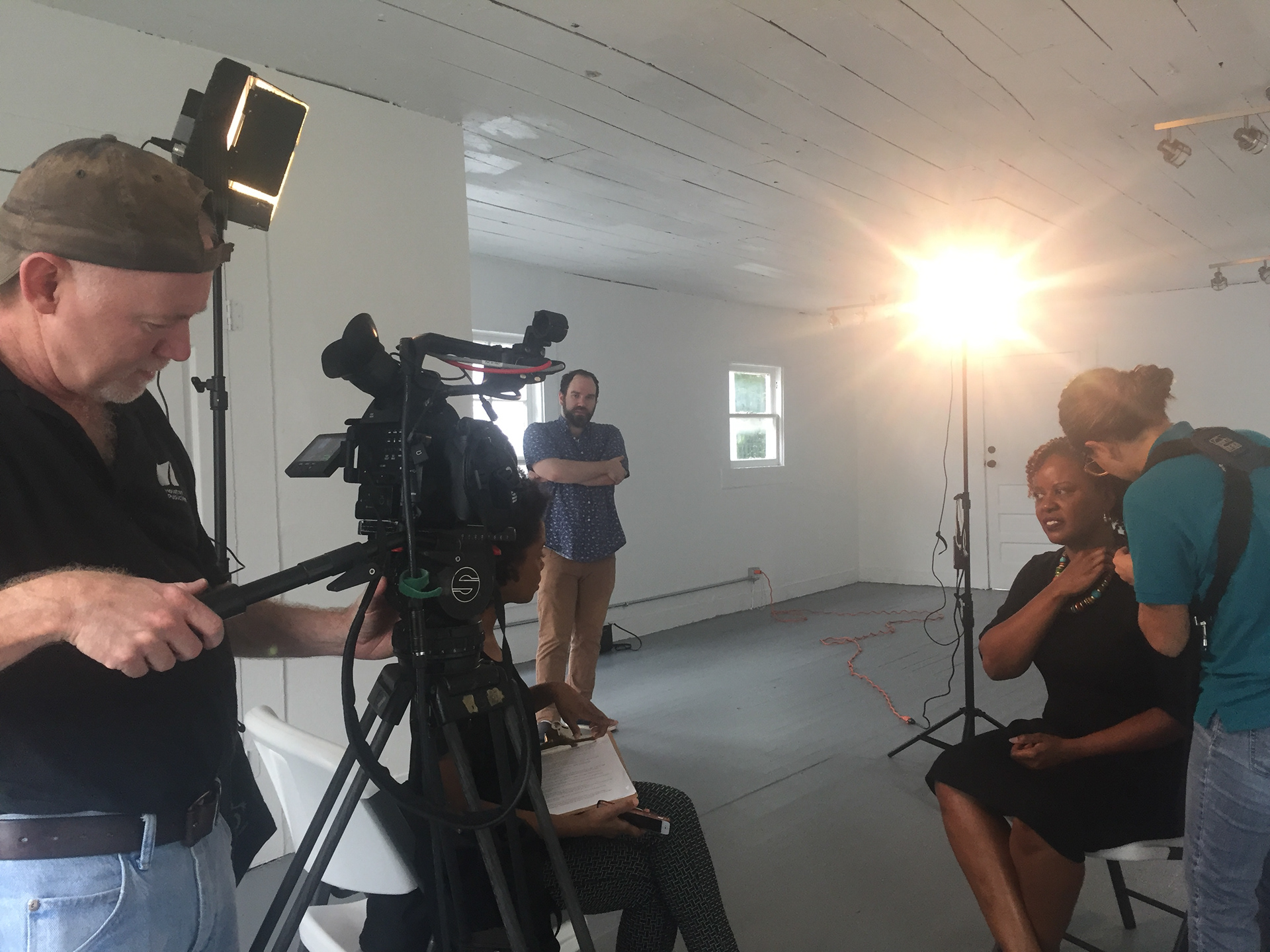 Recording for a feature on Project Row Houses on Arts Insight with Joe and Macie, as she mics PRH Exec. Director, Eureka Gilkey.