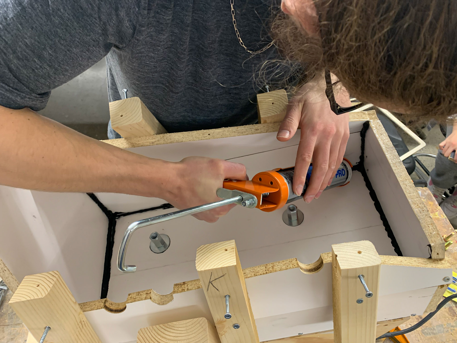 Using caulk to seal the mold and add a radius to the base