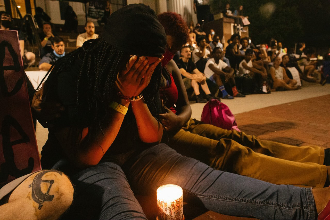 A young woman cries during the 9 minutes of silence honoring George Floyd that wrapped up the evening.