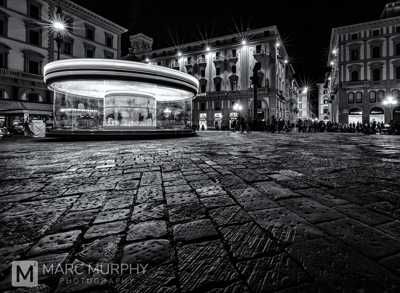 Black and White Piazza della Repubblica at Night in Florence Italy from Low Perspective with a Carousel in Motion