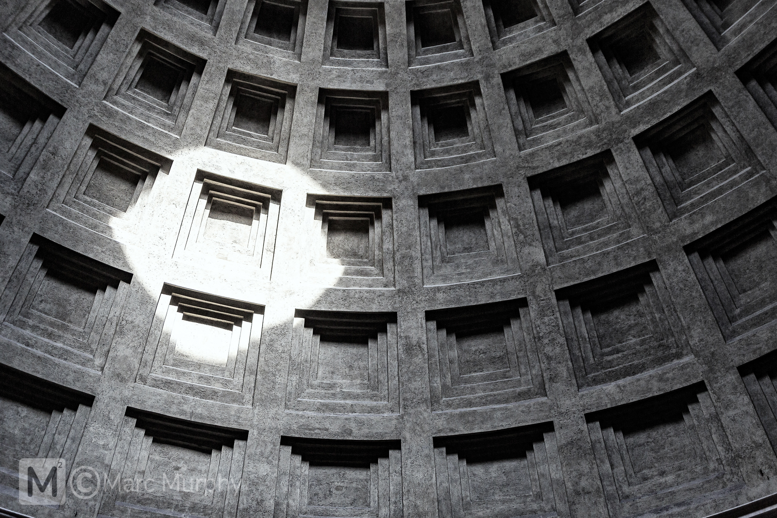 Black and White Abstract of the Round Coffered Ceiling of The Pantheon in Rome Italy with the Sun Making a Spotlight on the Ceiling