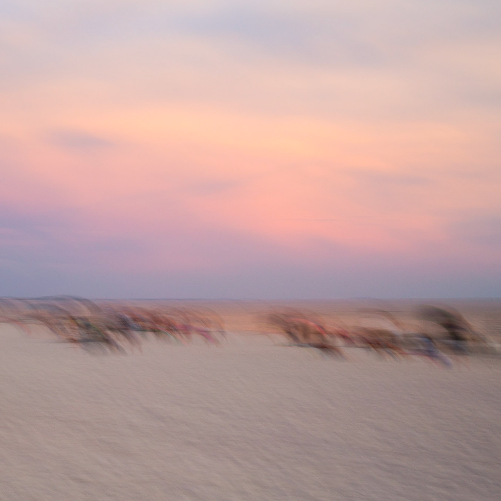 Beachgoers watching the sunset over the Gulf of Mexico, Madeira Beach FL