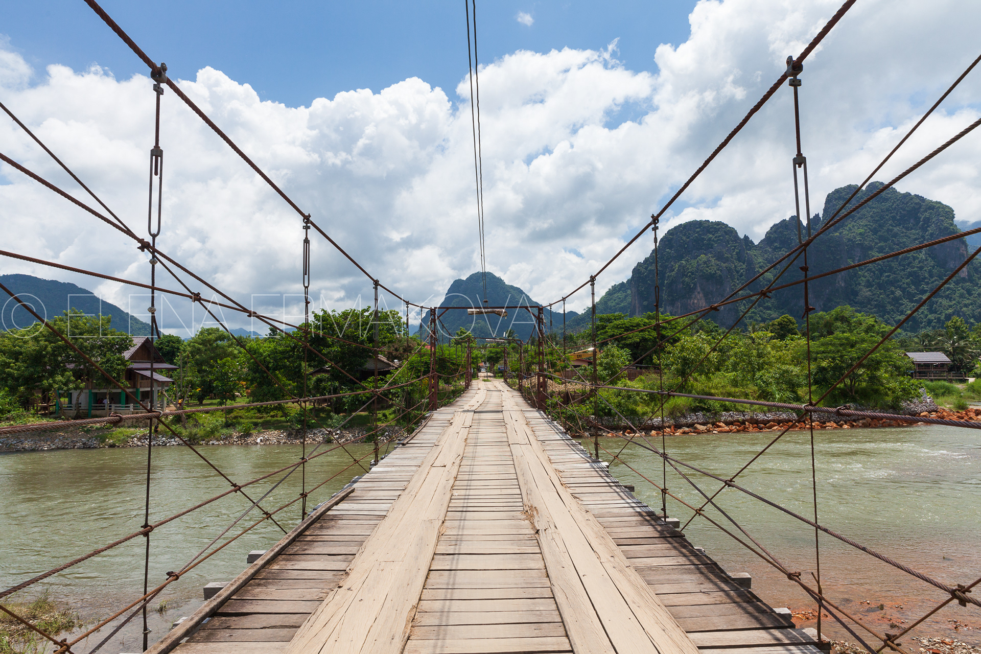 Wooden bridge over Nam Song river, Vang Vieng, Laos.