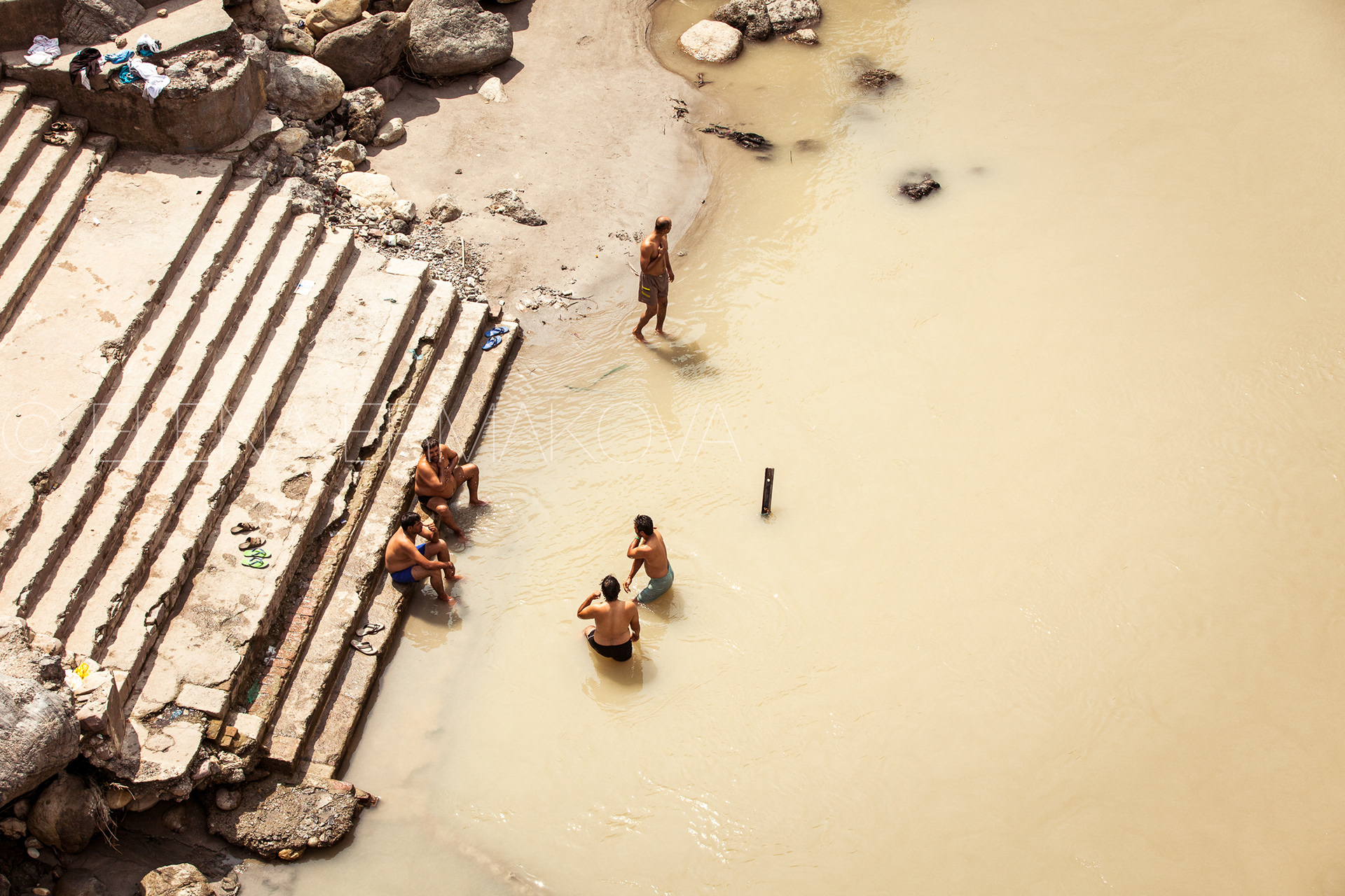Indian men bathe in the Ganges River, Rishikesh, India.