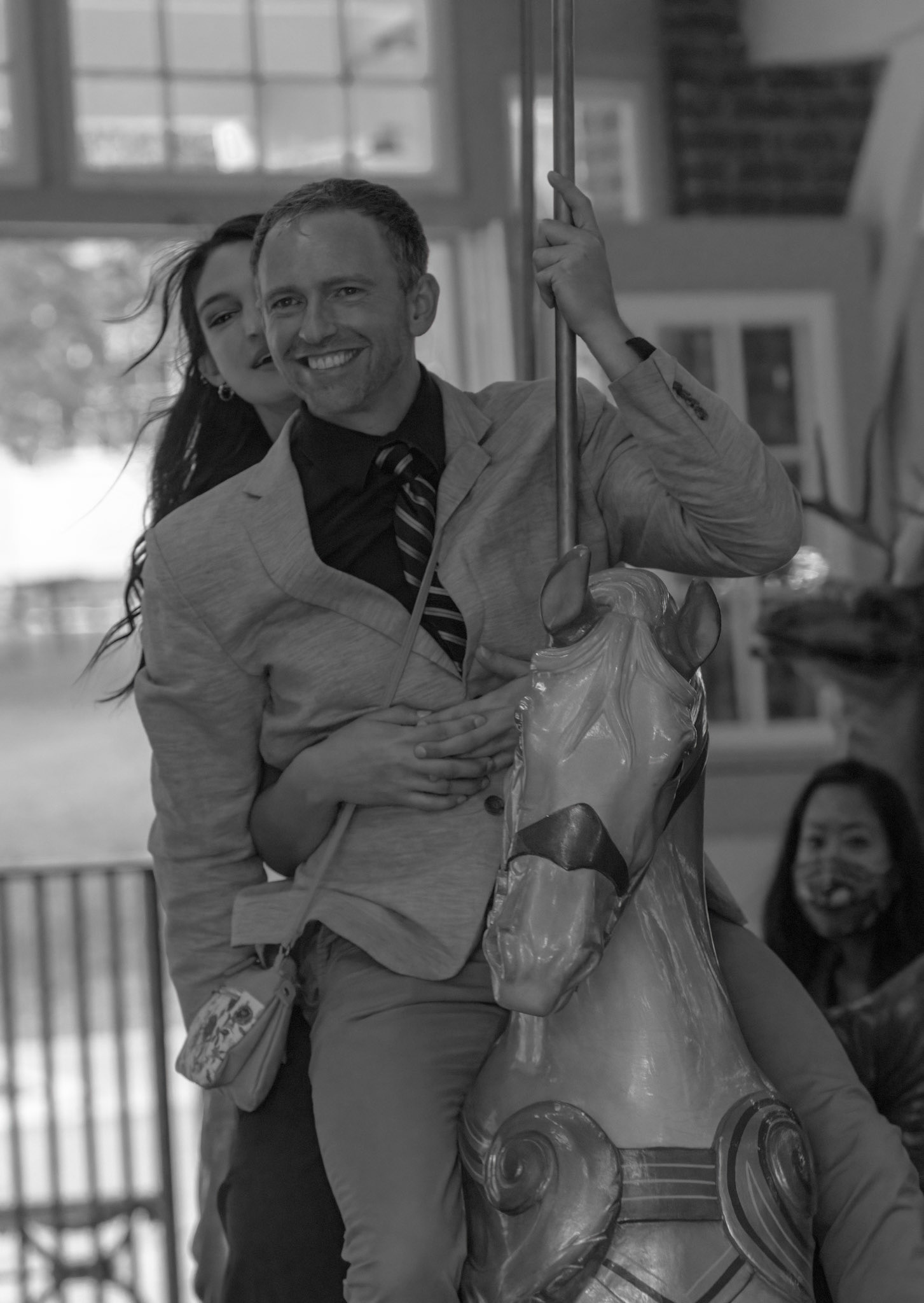 I took this image at Glen Echo Park soon after a wedding had ended. Many of the wedding guests went to ride on the century-old Bentzel Carousel. Of course I could not resist the sight of people dressed up for a wedding going to ride a merry-go-round. And I had my camera with me . . . .