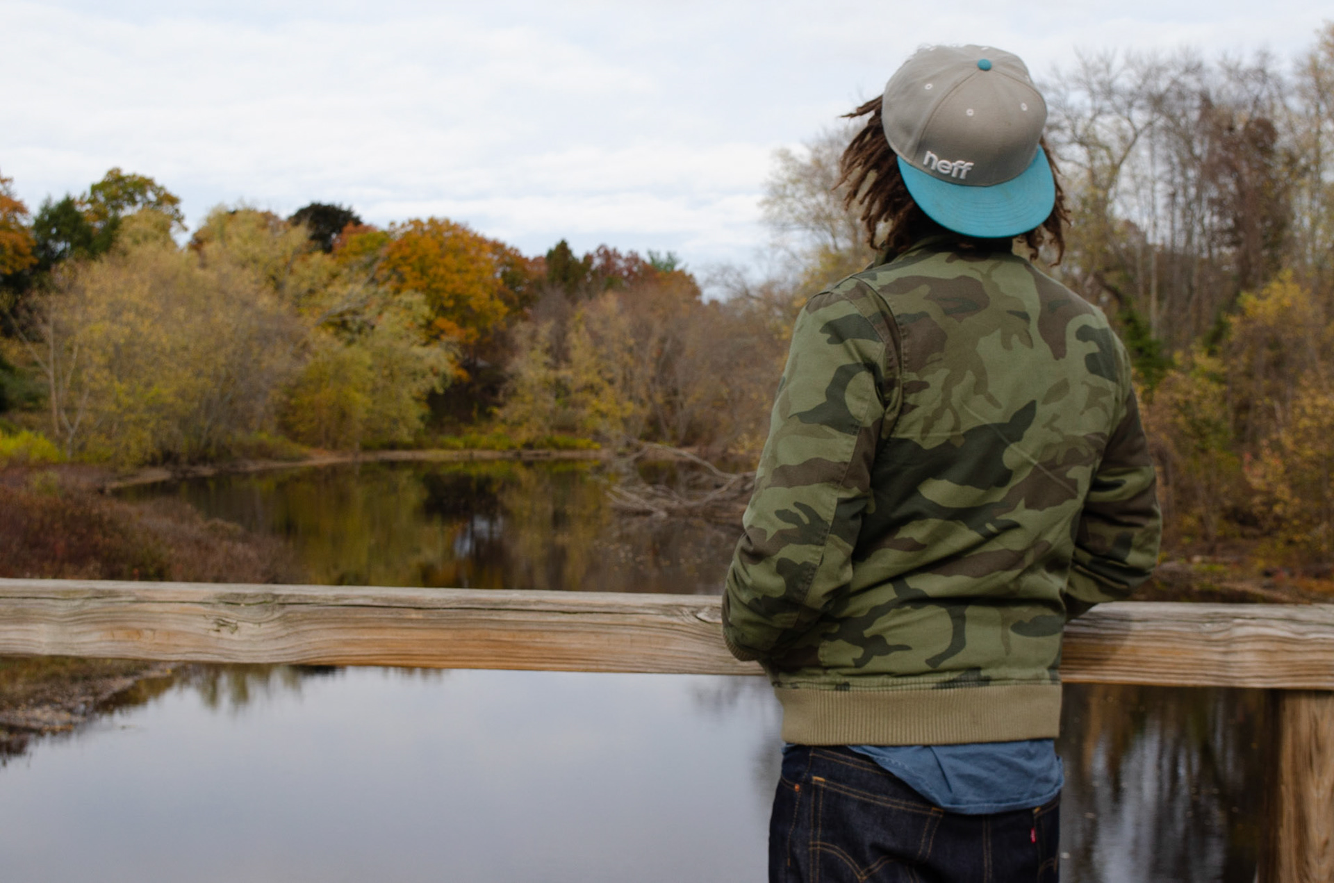 1. Damian Boyd looks off Concord Bridge onto Concord River on Sunday, October 25, 2020. Photo by Hannah Lee. 1/250 f8 iso 400