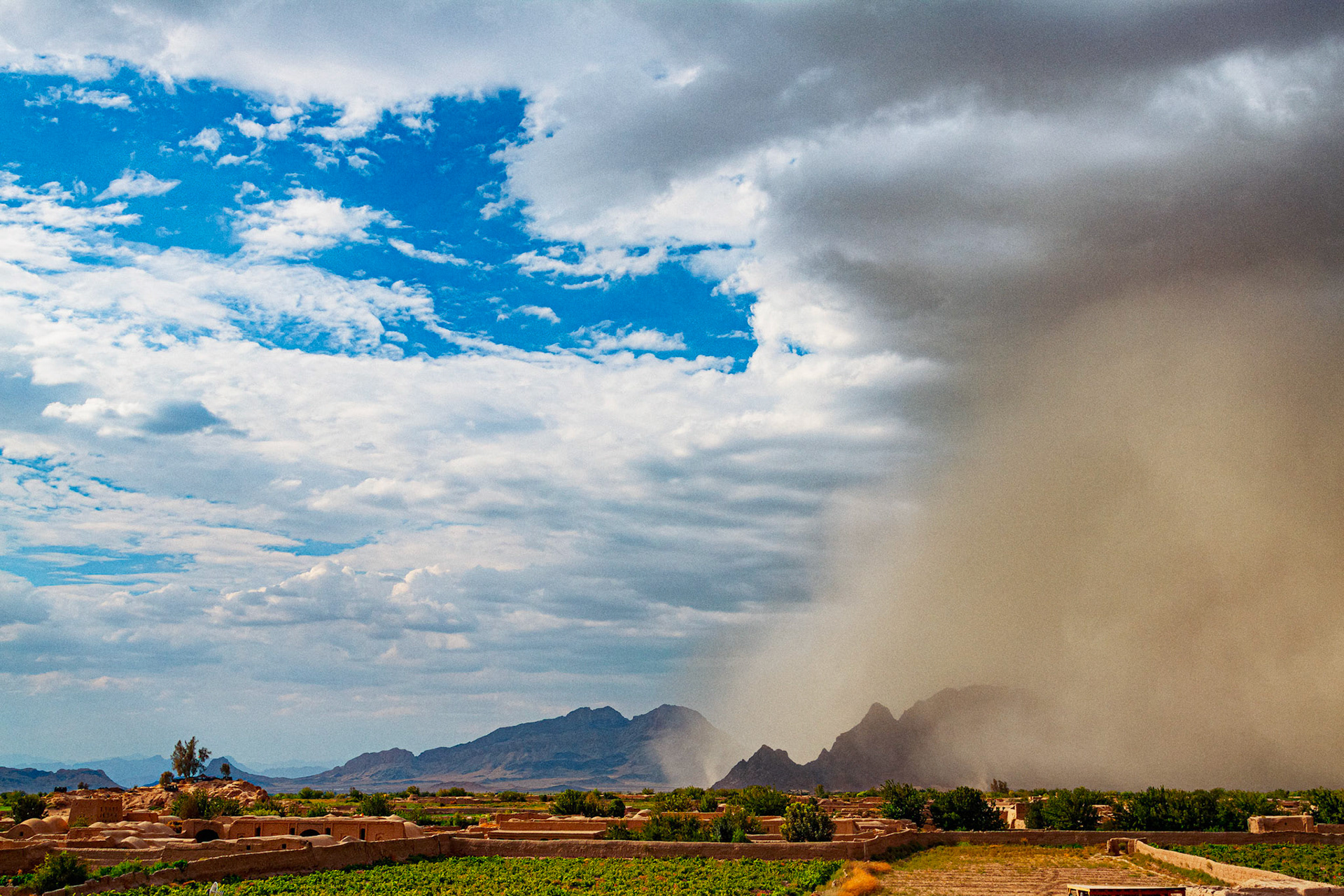 Kandahar, Afghanistan - 5 AUGUST 2010: A massive sandstorm completely engulfs the mountains.