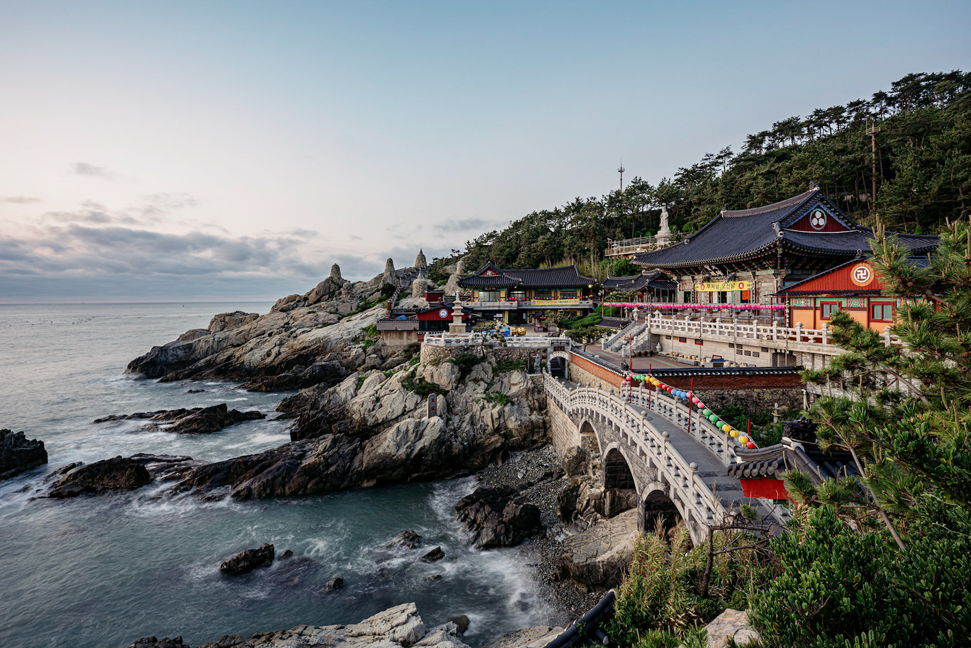 Busan, South Korea - 22 May 2020: Haedong Yonggungsa, self-advertised as Korea's most beautiful temple, sits on a rocky shoreline north of Busan. It faces east to see the sunrise each morning.