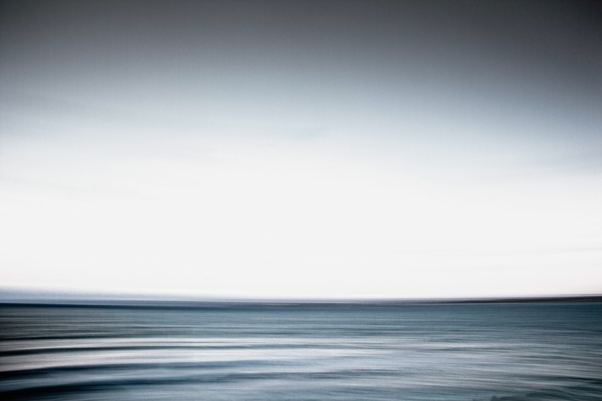Surreal and atmospheric calm sea with blurred focus, St Ives, Cornwall, England, November 2012.