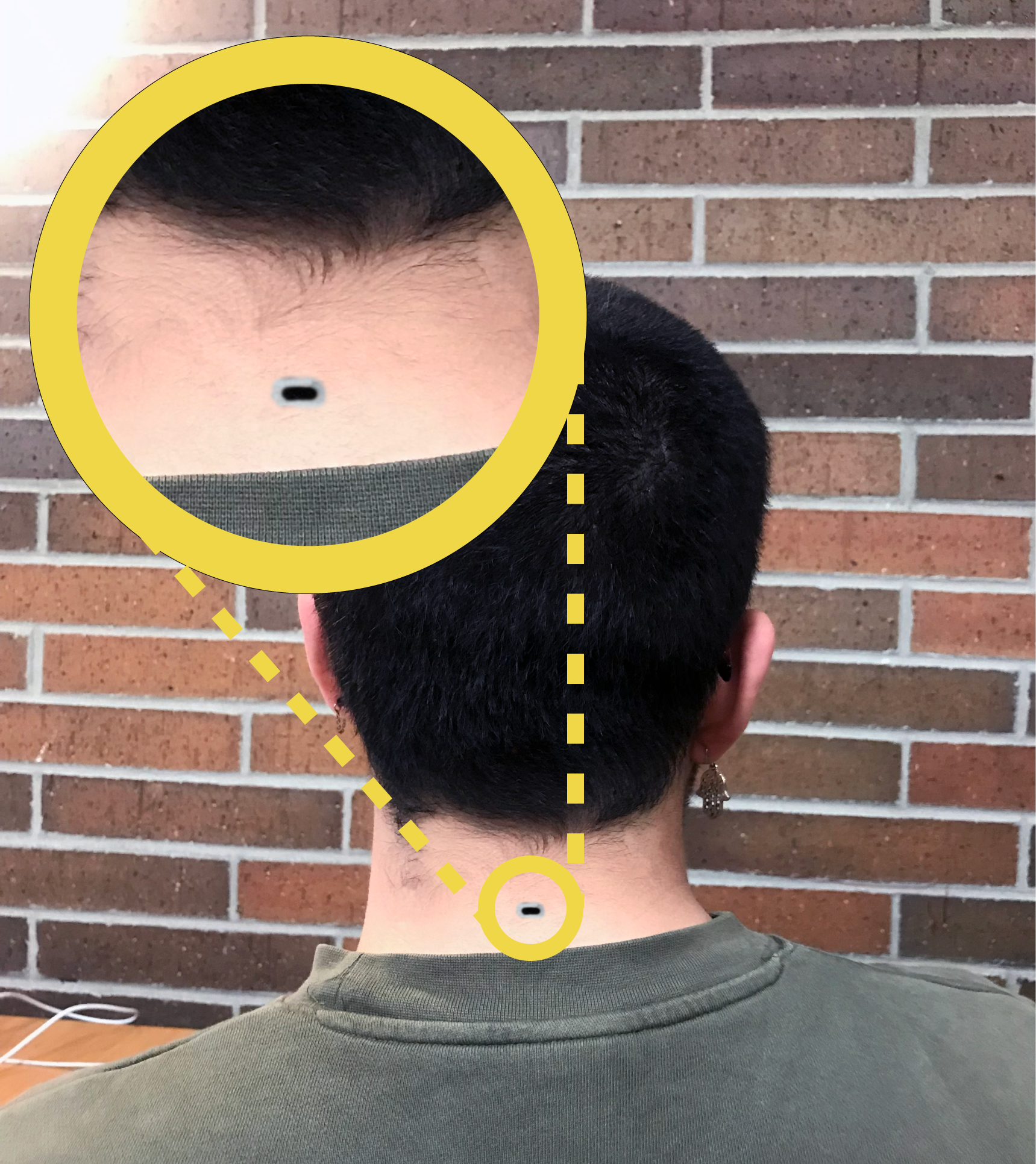 A man with a usb c port on their neck