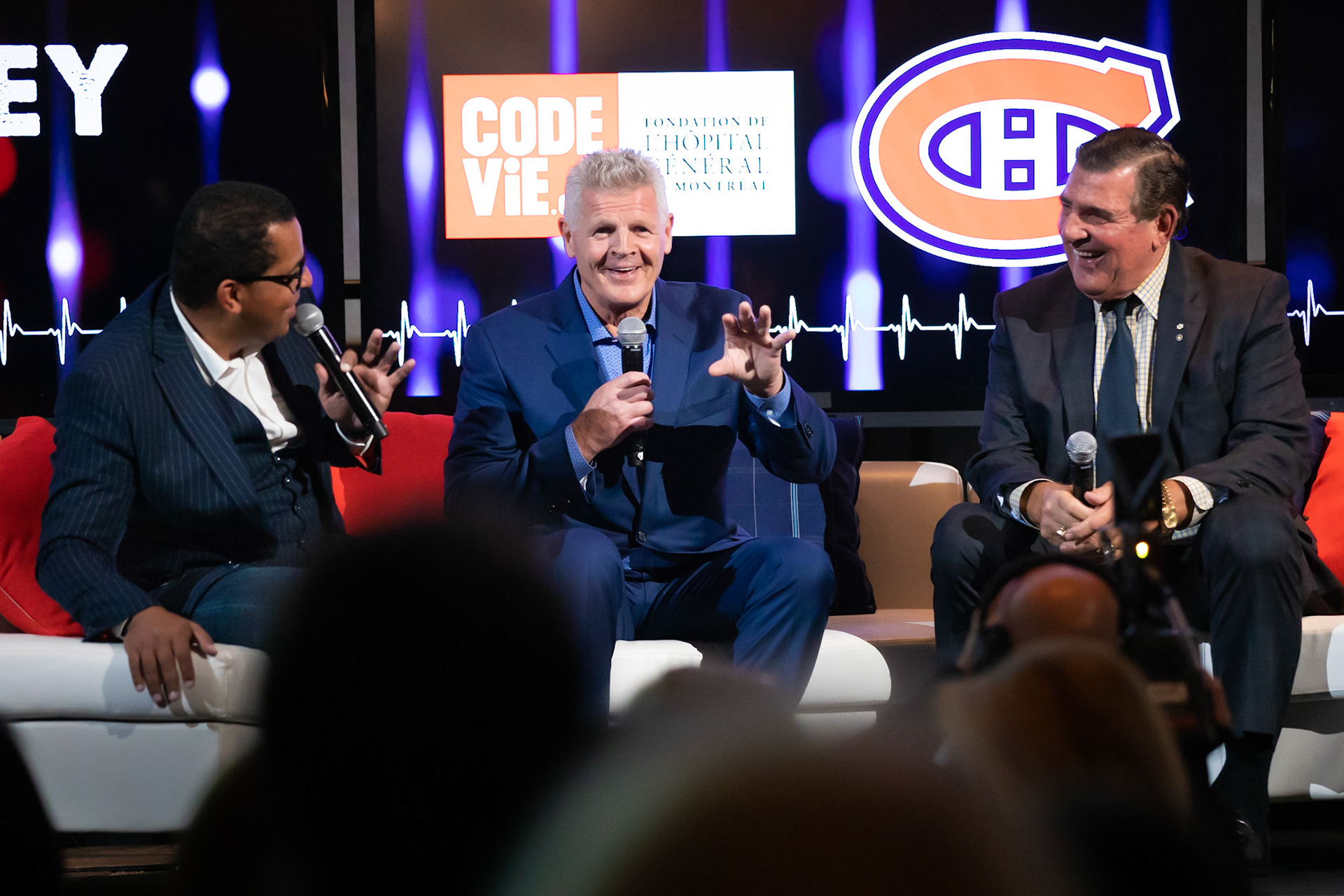  Gregory Charles and Serge Savard laugh as Canadiens legend Chris "Knuckles" Nilan relates one of many colourful war stories at “Hockey911”, a fund-raiser for the Montreal General Hospital Foundation.  October 2019.