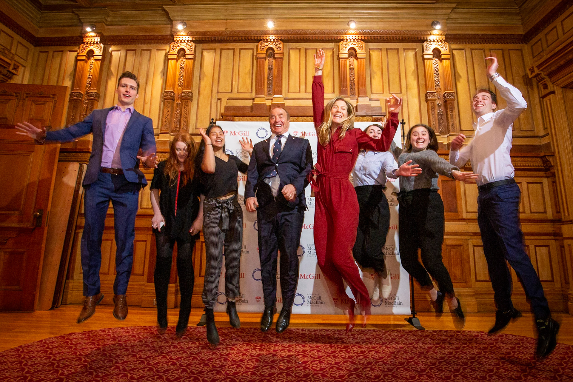 Students join John and Marcy McCall MacBain in a well-synchronized expression of enthusiasm after the announcement of their historic gift to the University. February 2019.