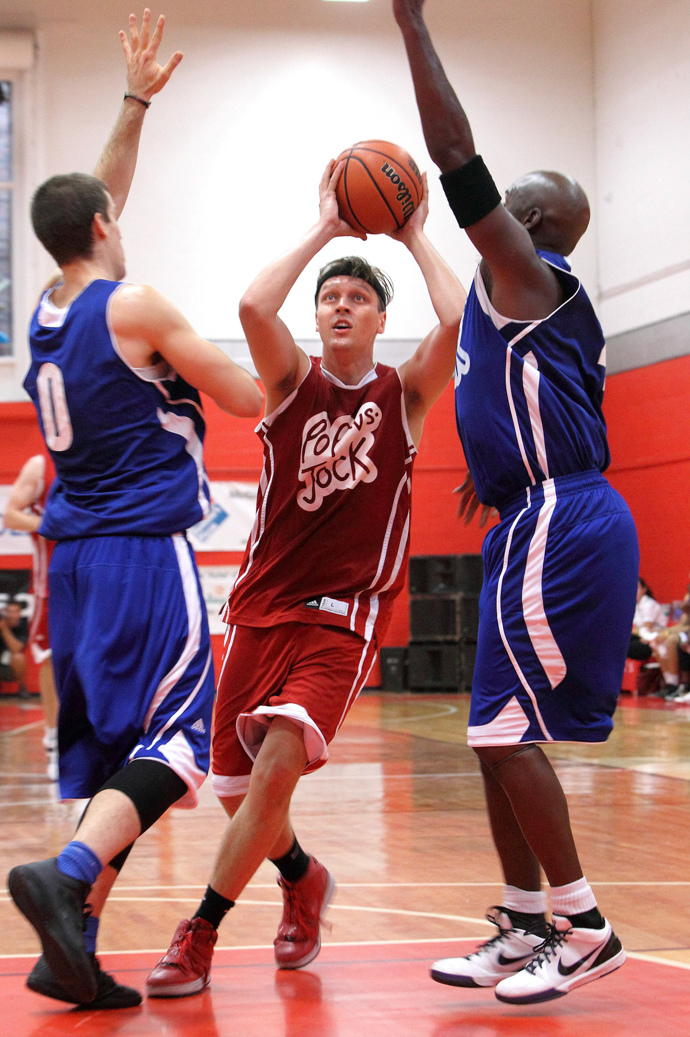  Arcade Fire’s Win Butler takes aim during the first POP vs. Jock charity fundraiser basketball game, September 2011.