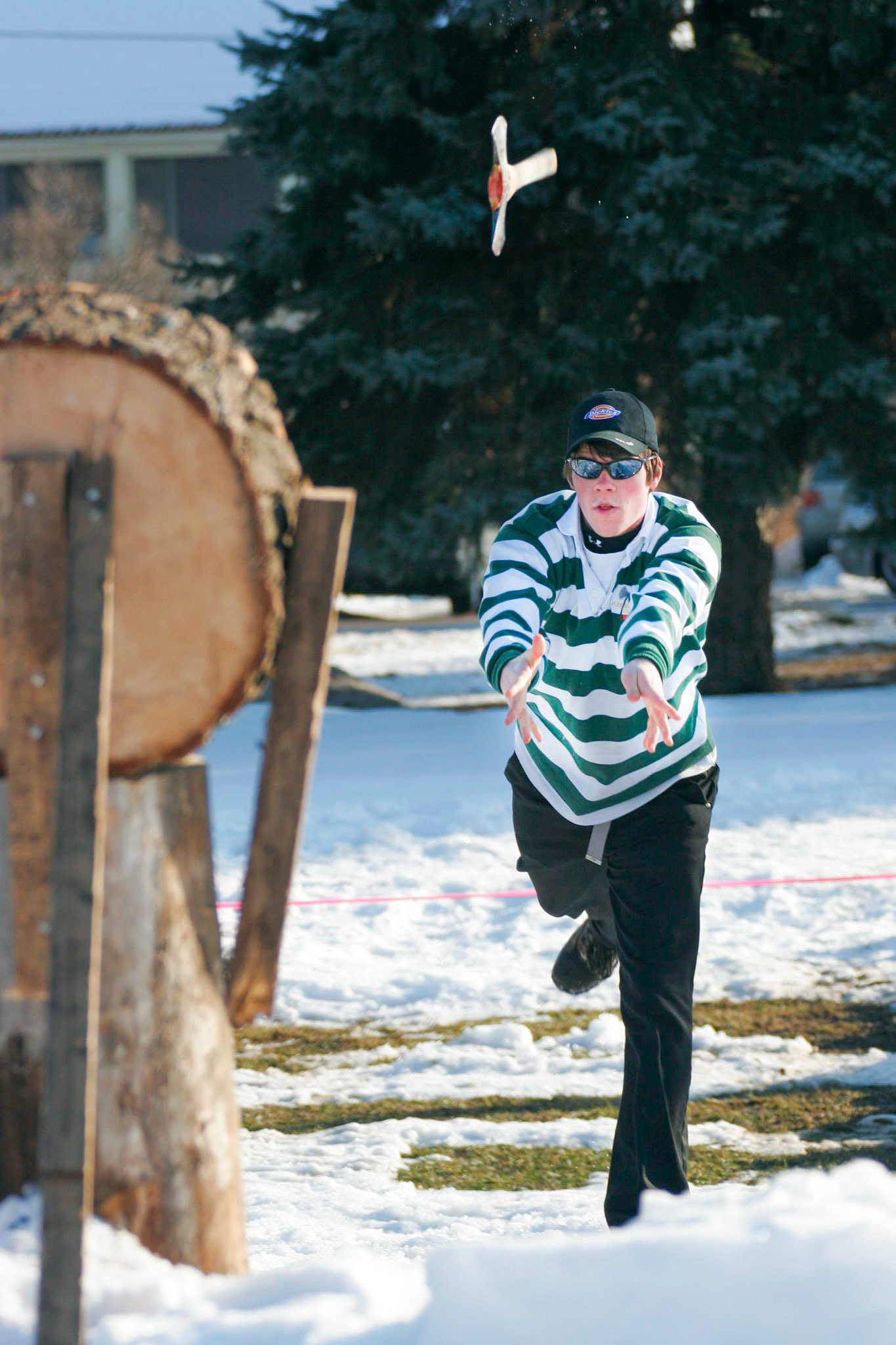 Axe-throwing at a Macdonald Campus Woodsmen competition.  Just after I took this photo I was removed by a concerned security guard. January 2006.