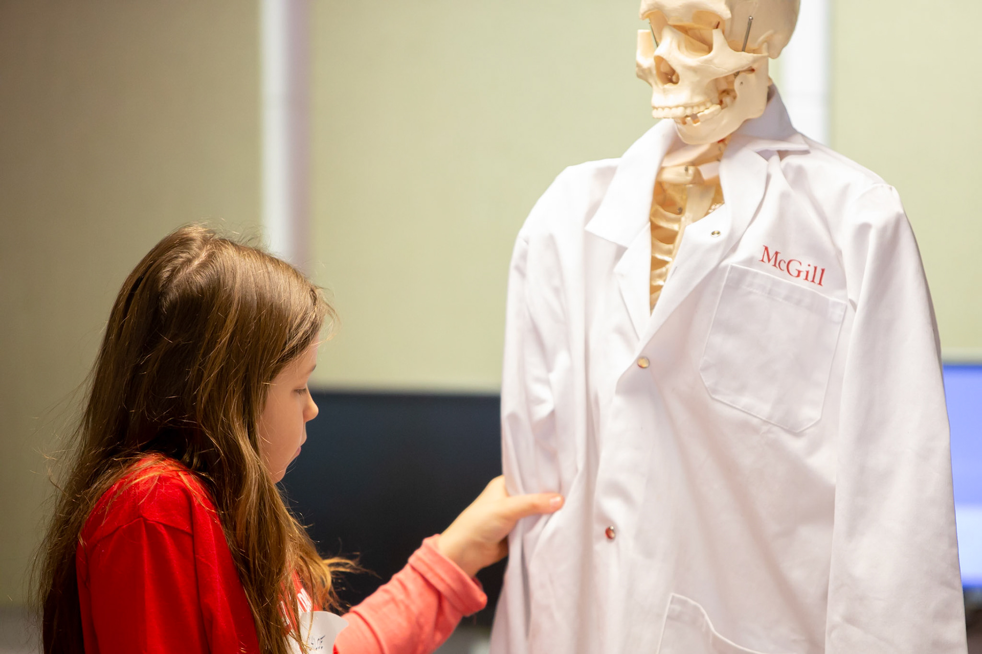 An elementary school student has a contemplative moment at the MyDay@McGill event, April 2018.