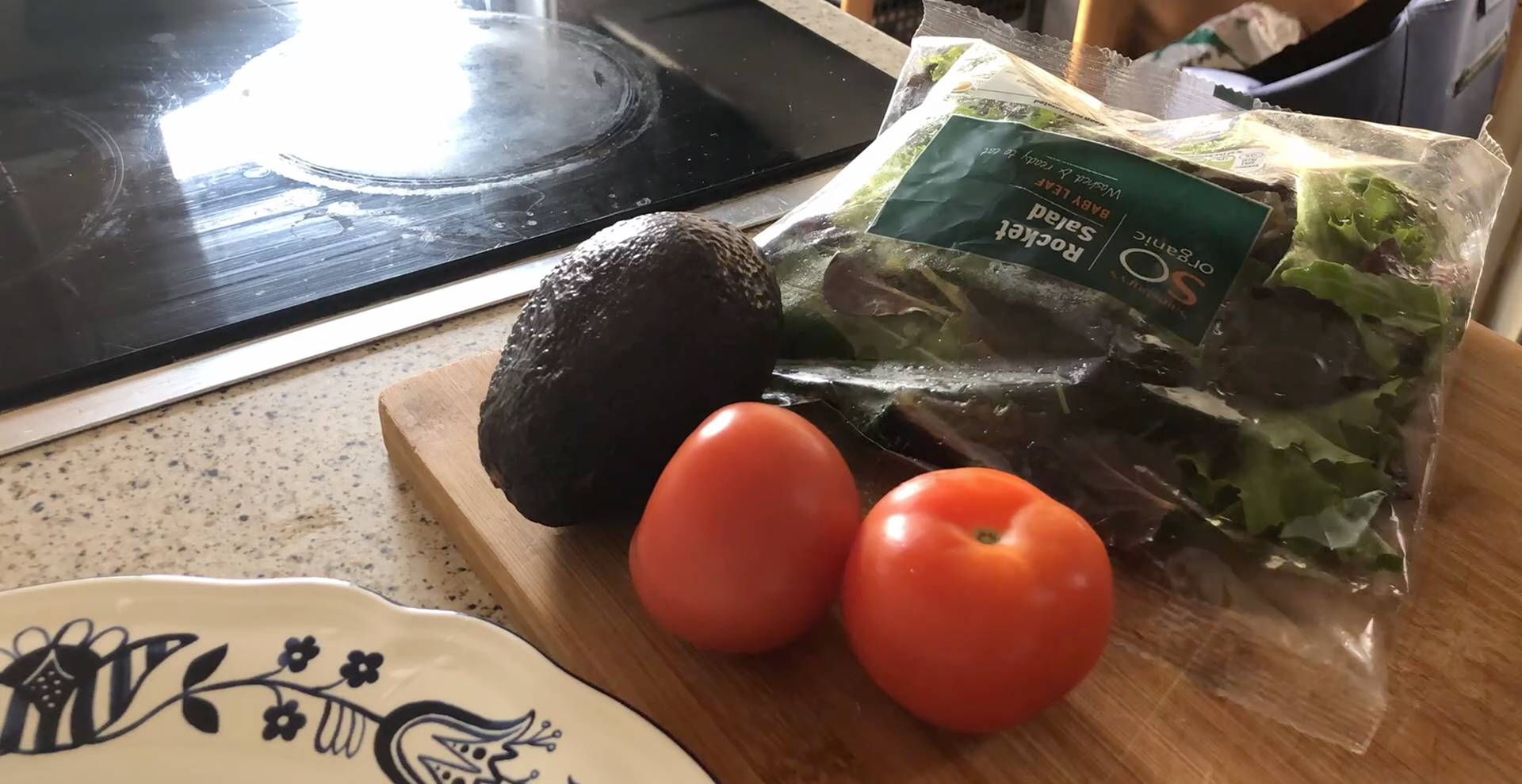 Getting Ready To Prepare Rocket Salad With Avocado, Tomatoes And Cucumber