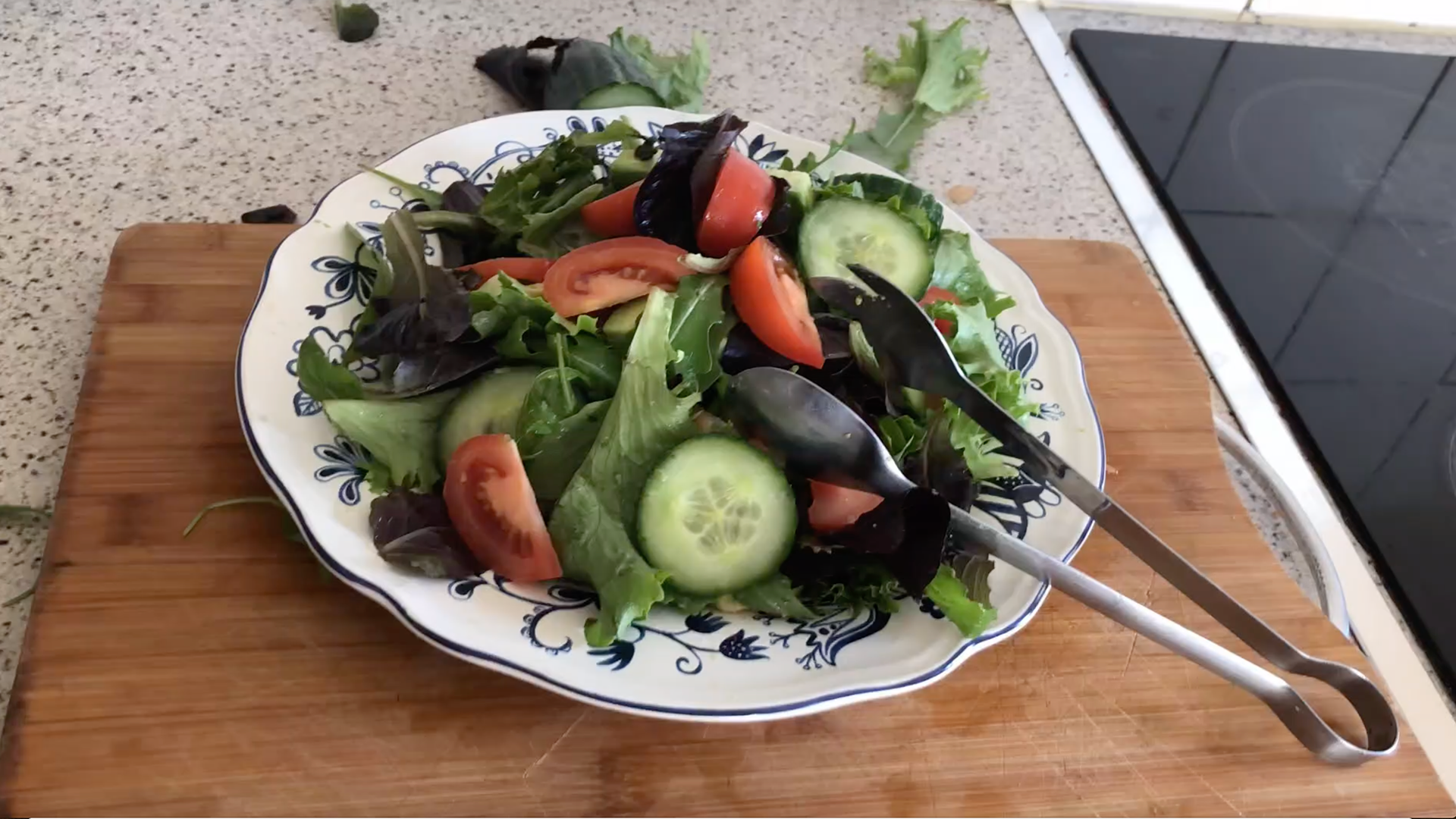 Preparing Rocket Salad With Tomatoes, Cucumber And Avocado
