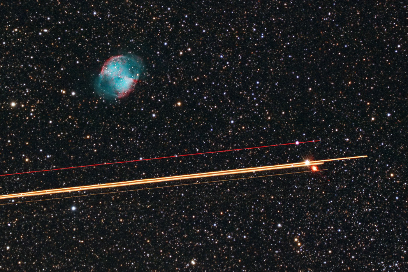 The Dumbbell Nebula and Passing Jet