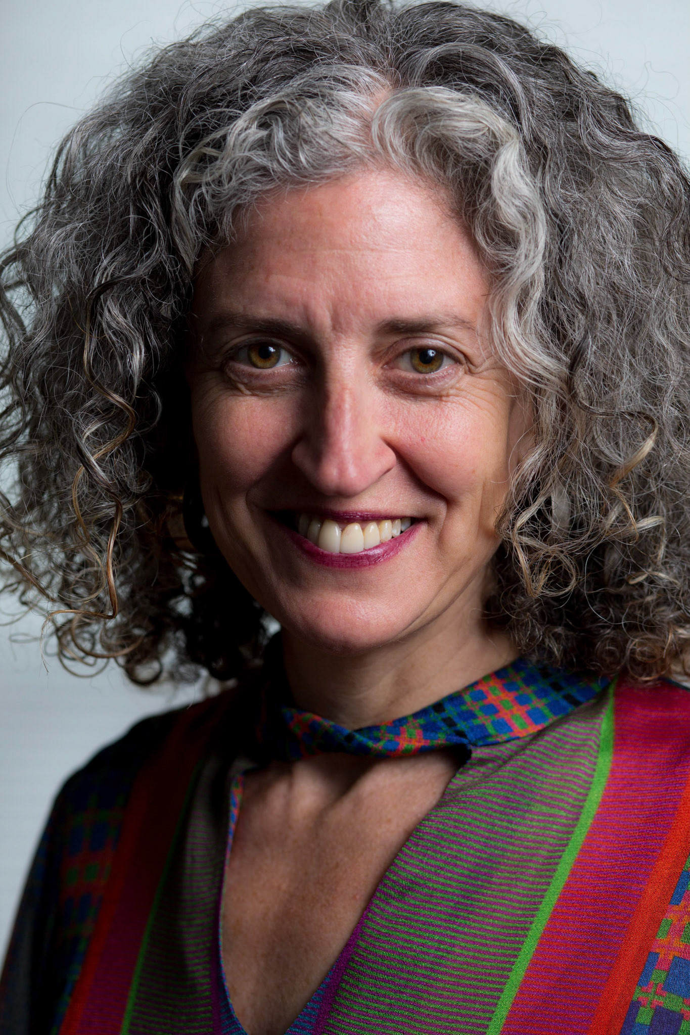 Portraits and headshots of Mikaela Seligman, CEO of AchieveMission.