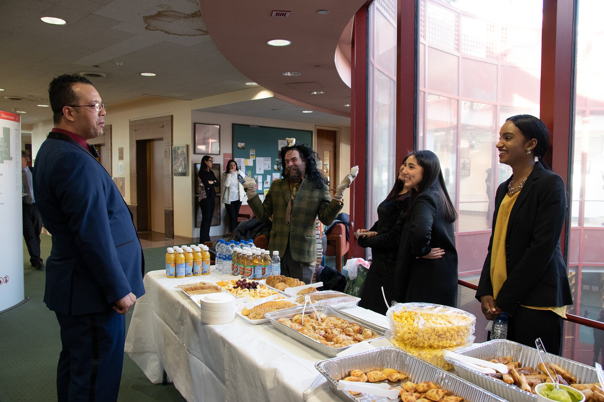 CDS members bantering at the refreshments table