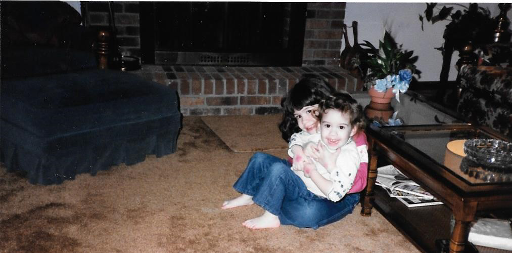 Kristy as a young child with her kid sister Jenny. Copyright 2020 Kristy Boyd