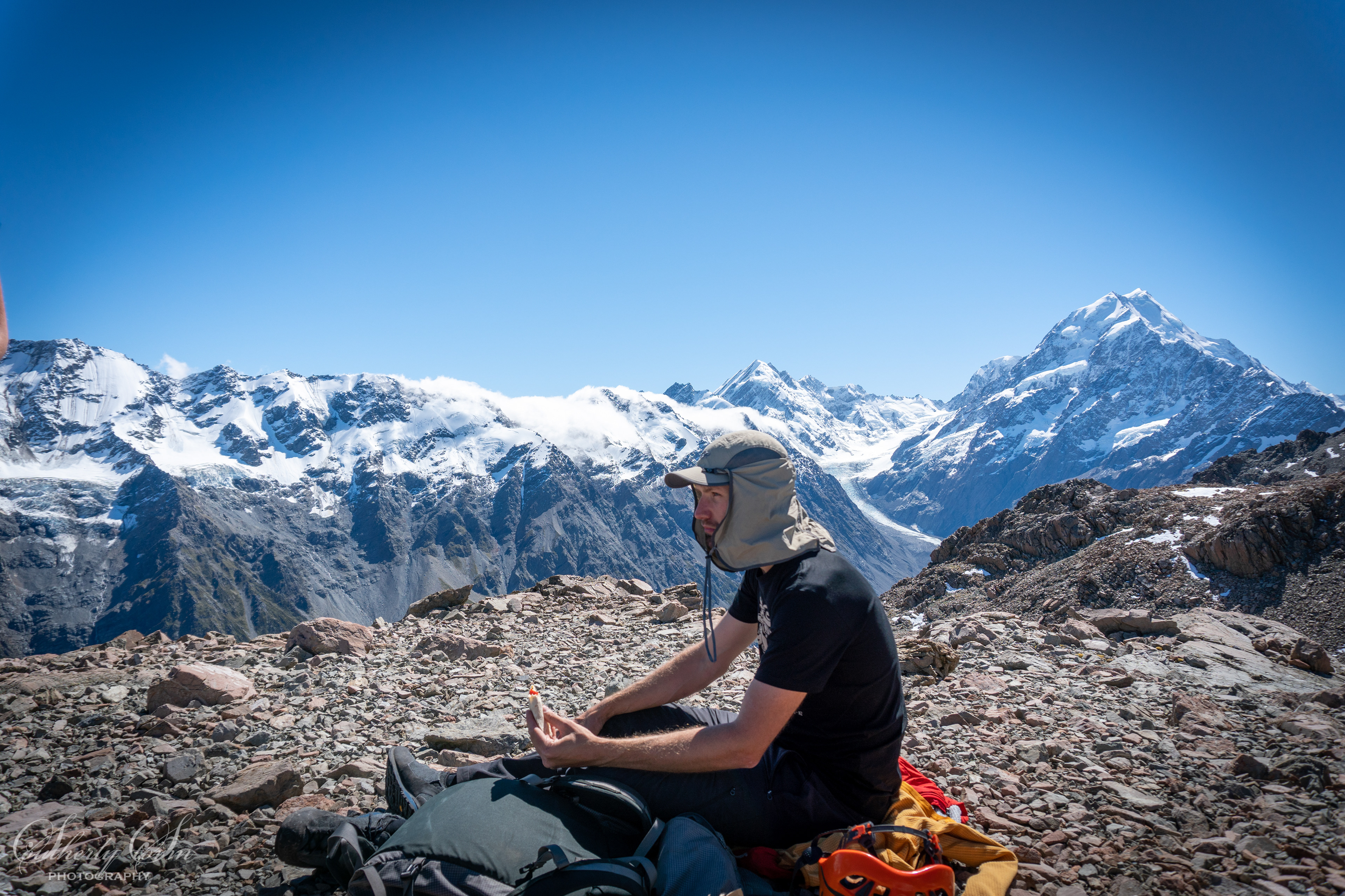 Lunch at the top of guideless butress with Aoraki Mt Cook in the background