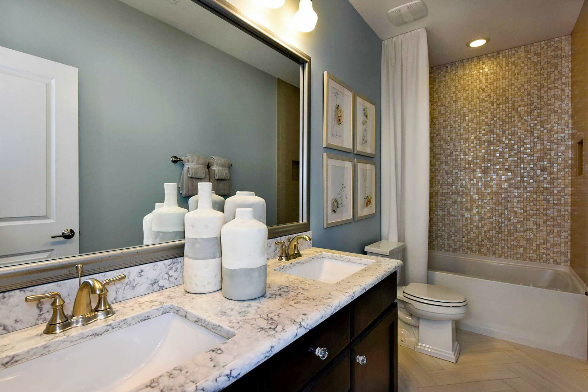 Personal Selections: Tile & lighting. Other selections made by Merchandising Concepts. Photo Credit: Stanley Martin Homes