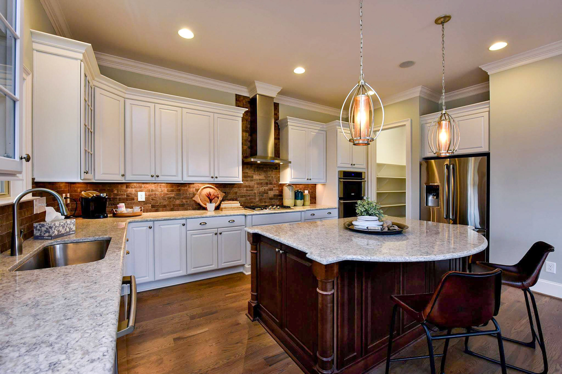 Personal Selections: Tile, flooring, and lighting. Other selections made by Merchandising Concepts. Photo Credit: Stanley Martin Homes.