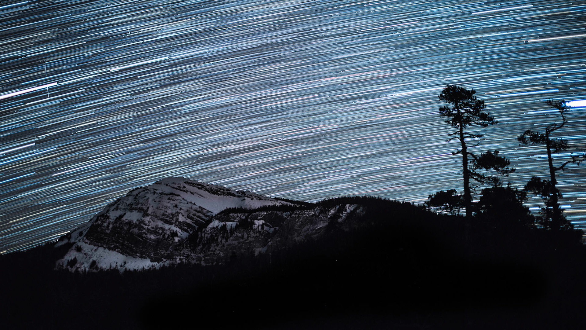 The stars shine and move over Elephant Mountain outside of Hoonah, Alaska.