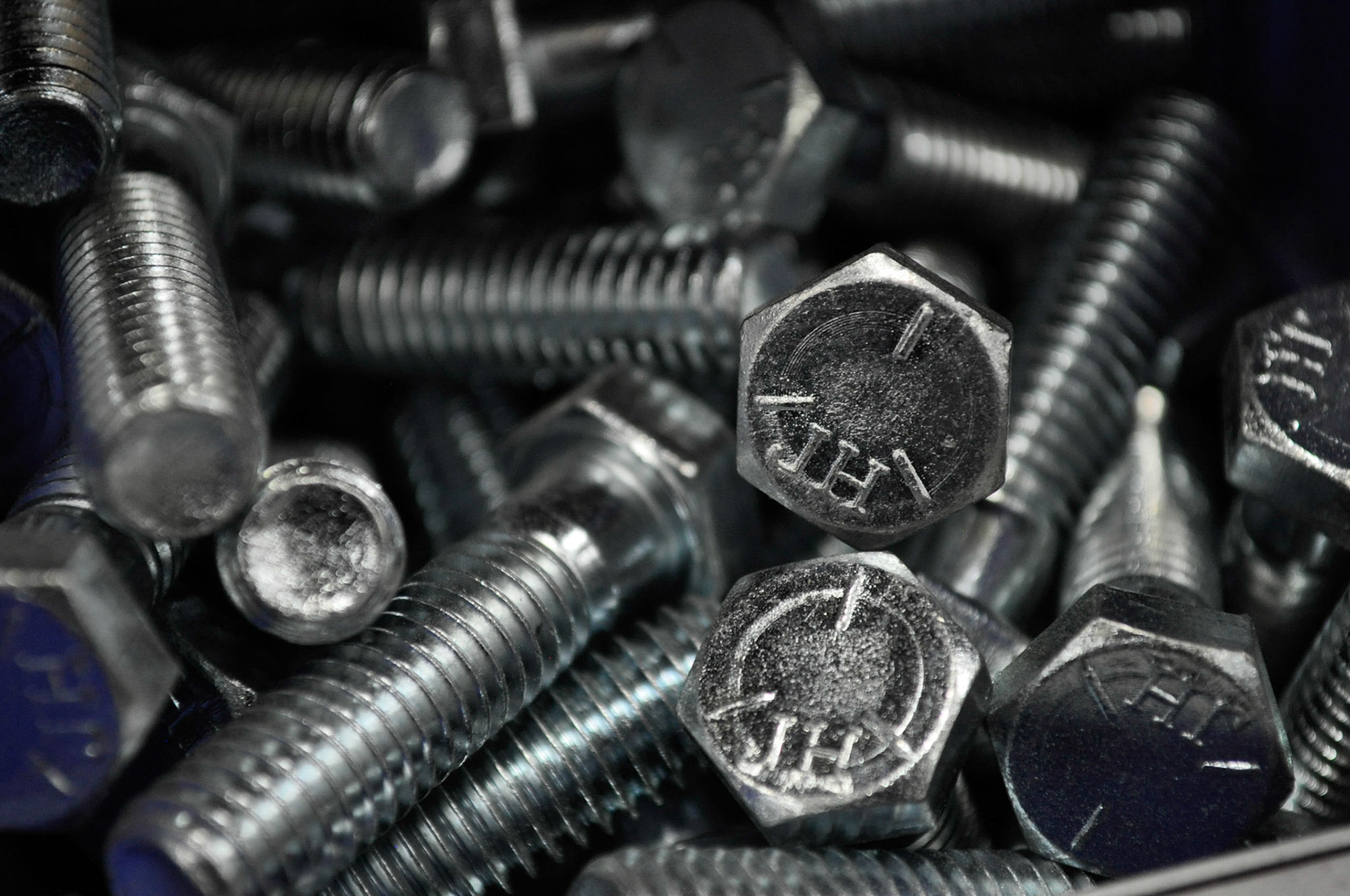 Close Up: Bolt bin, organized storage of bolts, 20200910 @ 2016, Idaho Wrecker Sales, Miller, interesting close up of the groves, edges, and texture of the material. Camera Settings: Nikon D500, ISO 800, 55mm, f/5.6, 1/80s