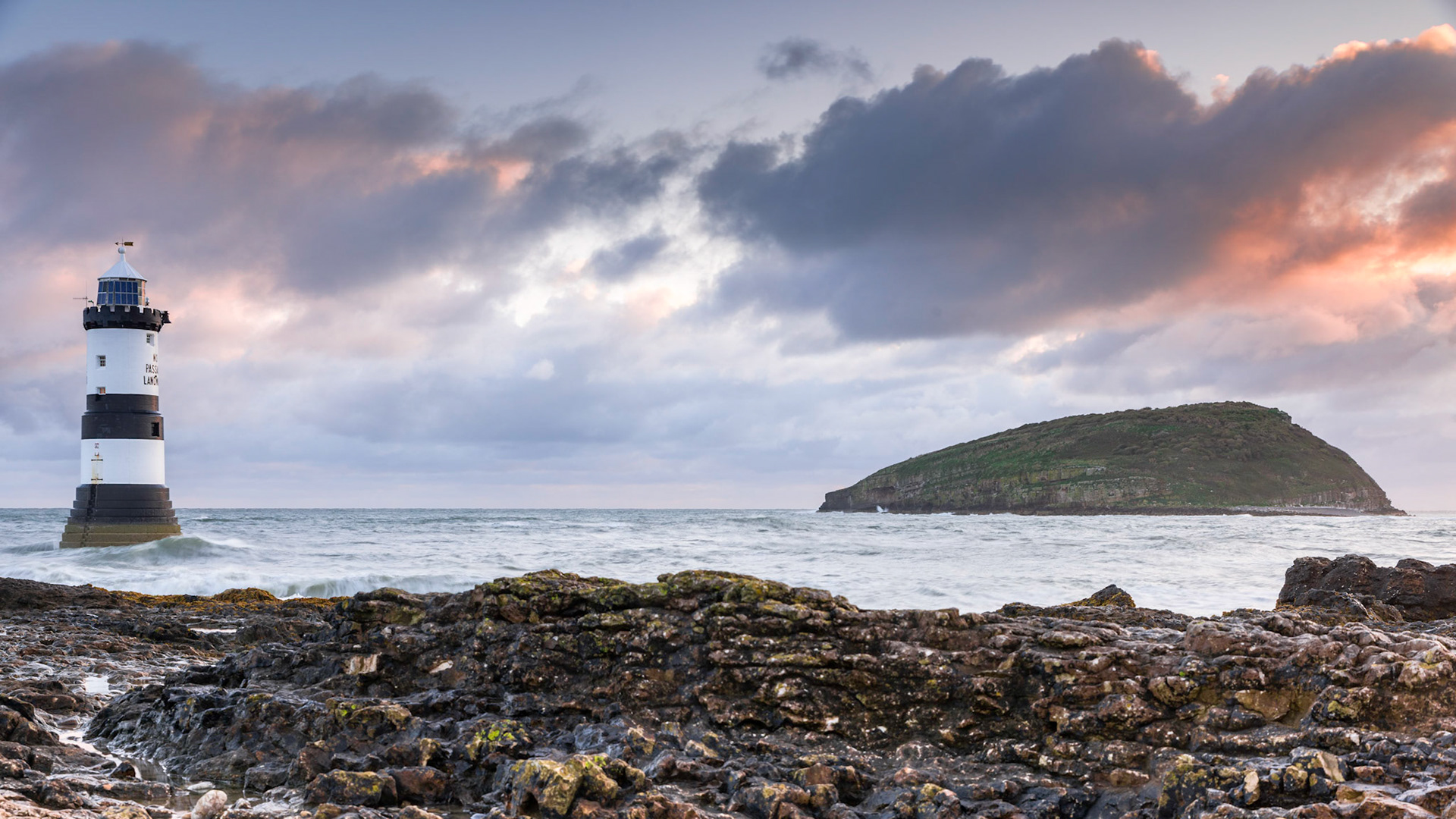 Sunrise at Penmon Lighthouse (Trwyn Du Lighthouse), Penmon, Isle of Anglesey, North Wales, UK