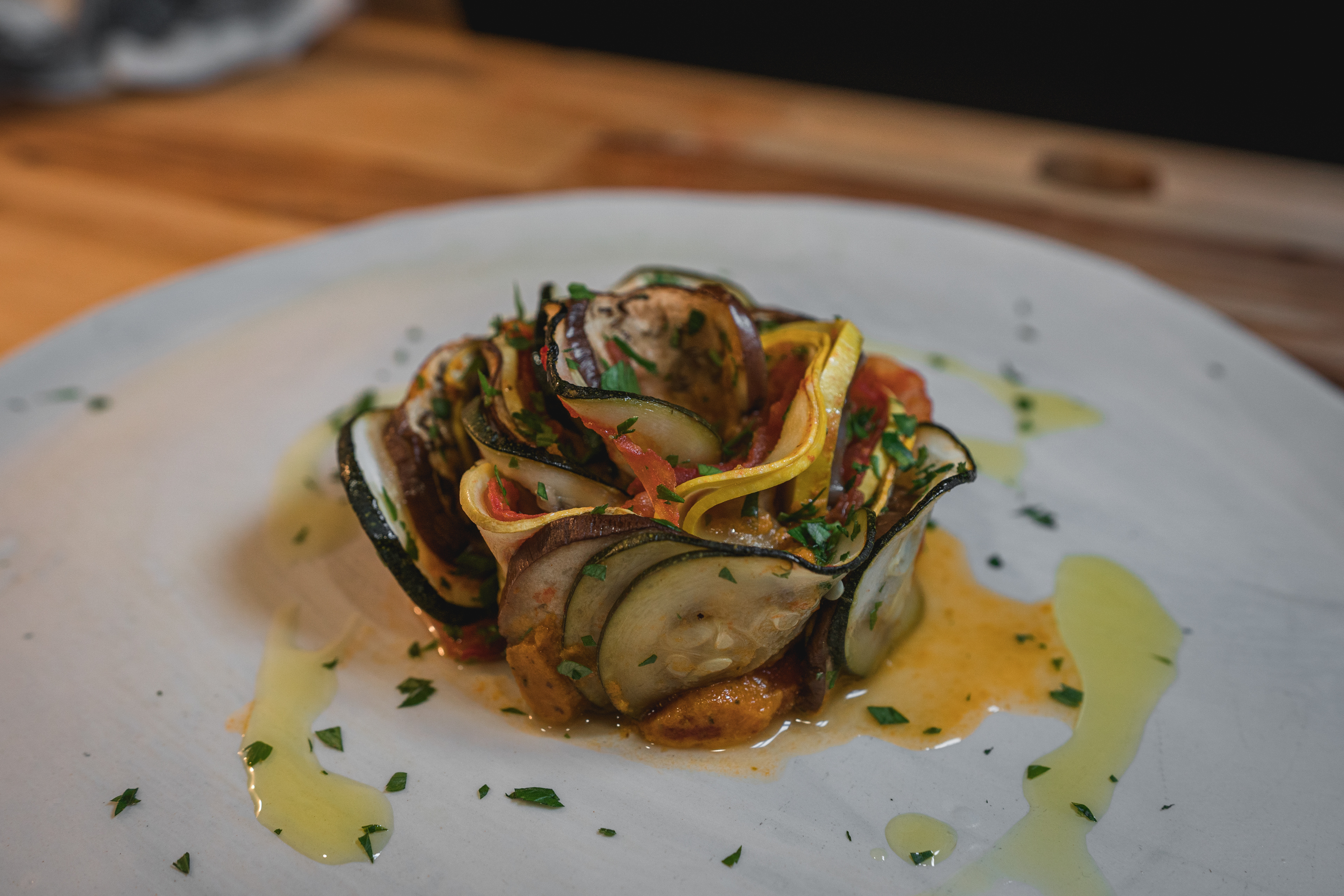 Use a ring mold to layer the vegetables on the plate
