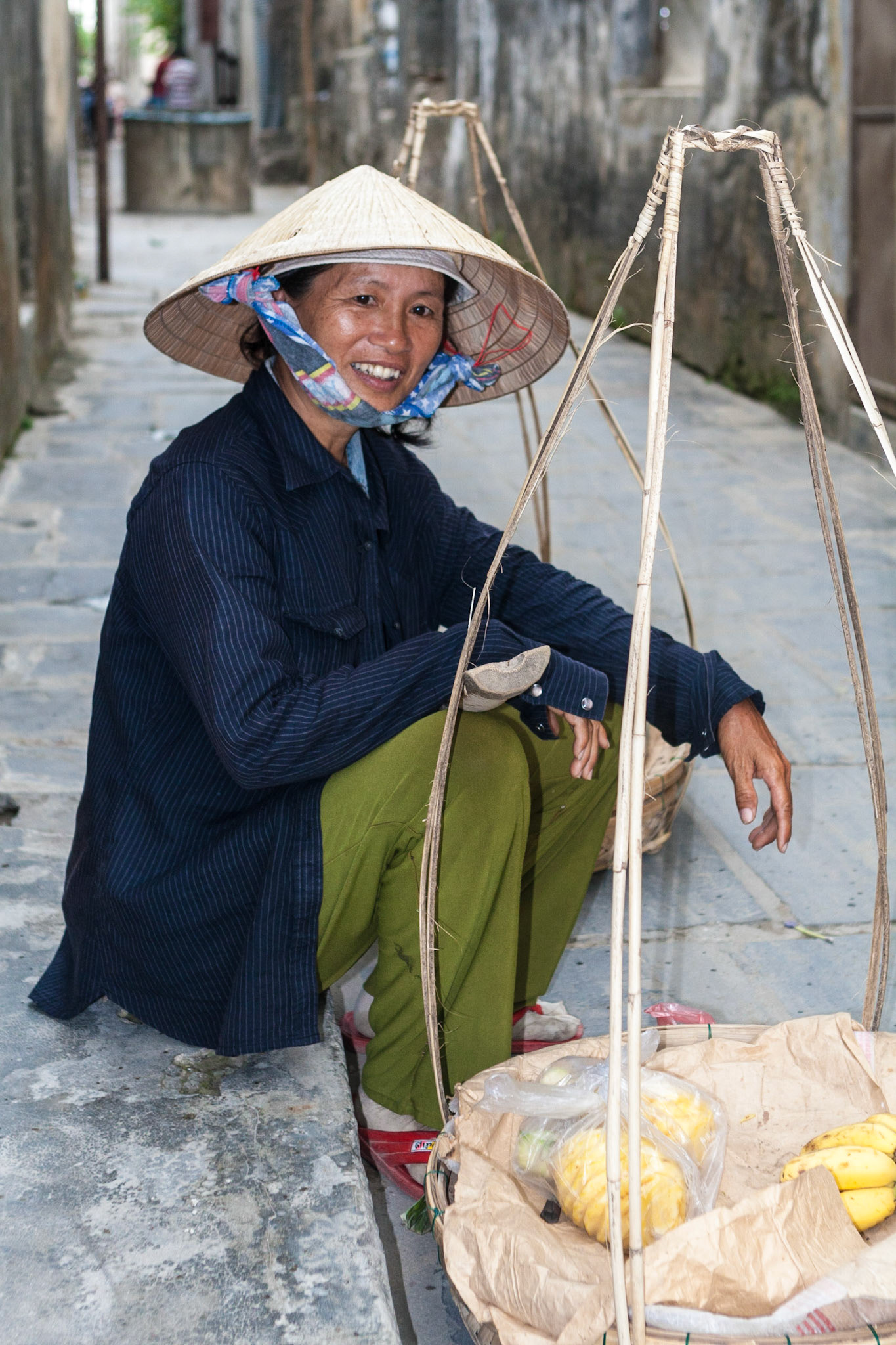 The portrait of a woman street vendor in Hoi An, Vietnam