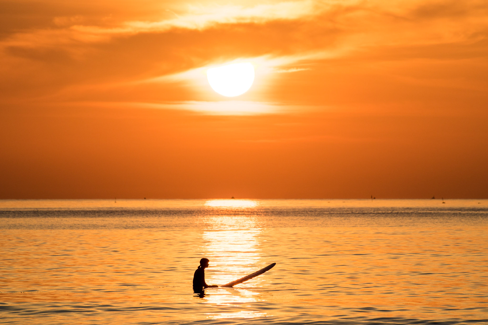 Warm .Silhouette. This is some days I shoot at Yilan with others. The weather that day was very nice, accompanied by the show of color temperature. When we focused on the sunrise, some of the water skiers broke the warm peace. At that moment, everyone were using the wide angle lens, they didn’t want to waste the precious time to change the lens, hoping to shoot the marvelous sunrise more. I grabbed my another camera and shoot the picture with color, texture, line, and the silhouette which was merging in the sea. #silhouette #texture #calm #shape #beach #beauty Landscapes