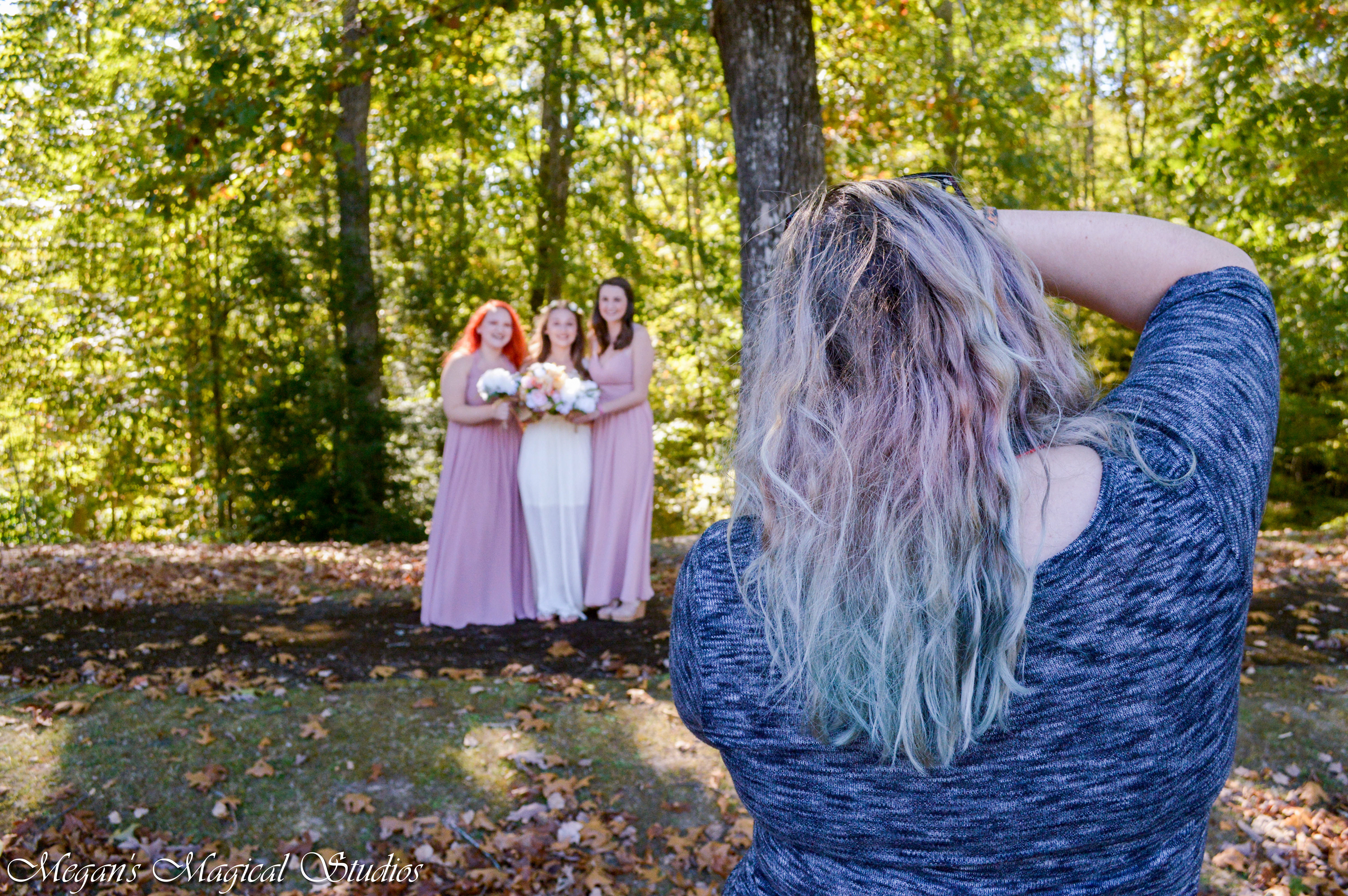 Megan, photographer, in action photographing a wedding