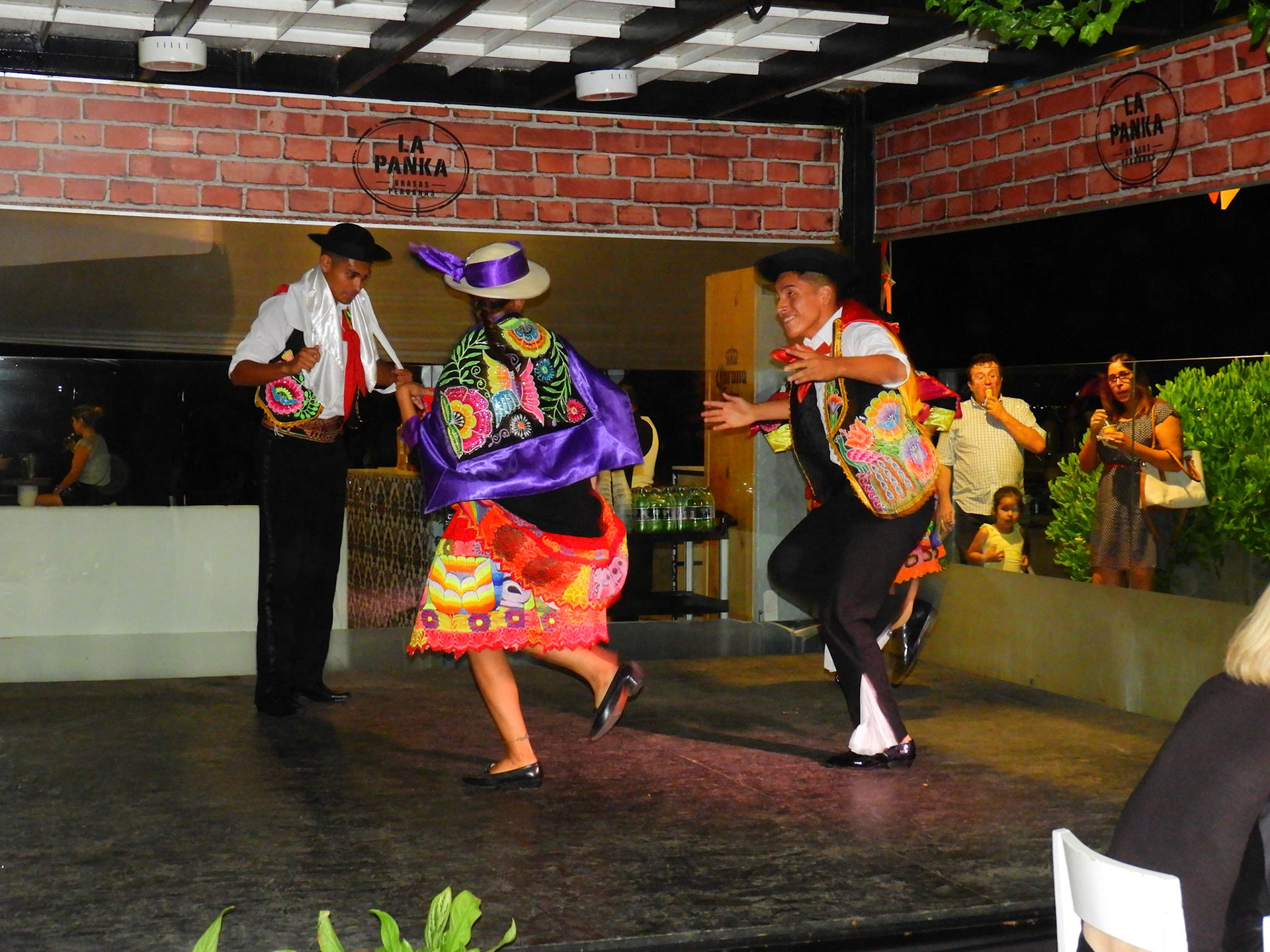 Dinner and folk dances at a restaurant on the beach