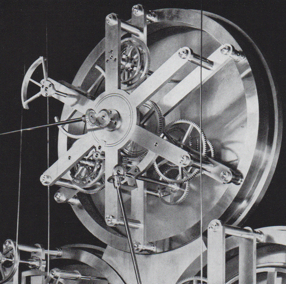 Detail of Rear of Equation Face : Whole works - top left is the quarter-round sector with steel ribbon from Equation mechanism and to left centre, the connection rod to main pendulum mean time mechanism.