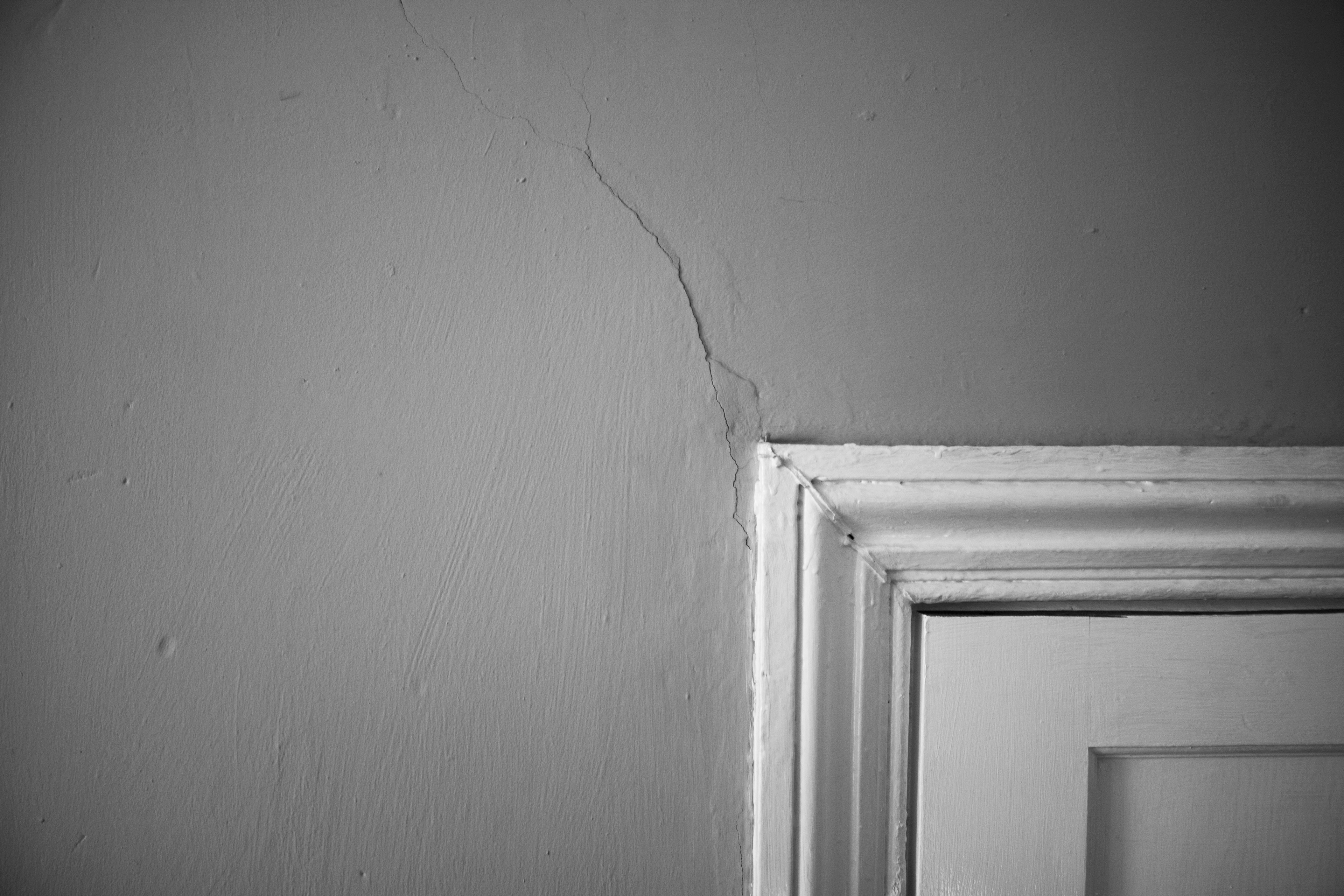 Crack in the wall above the door