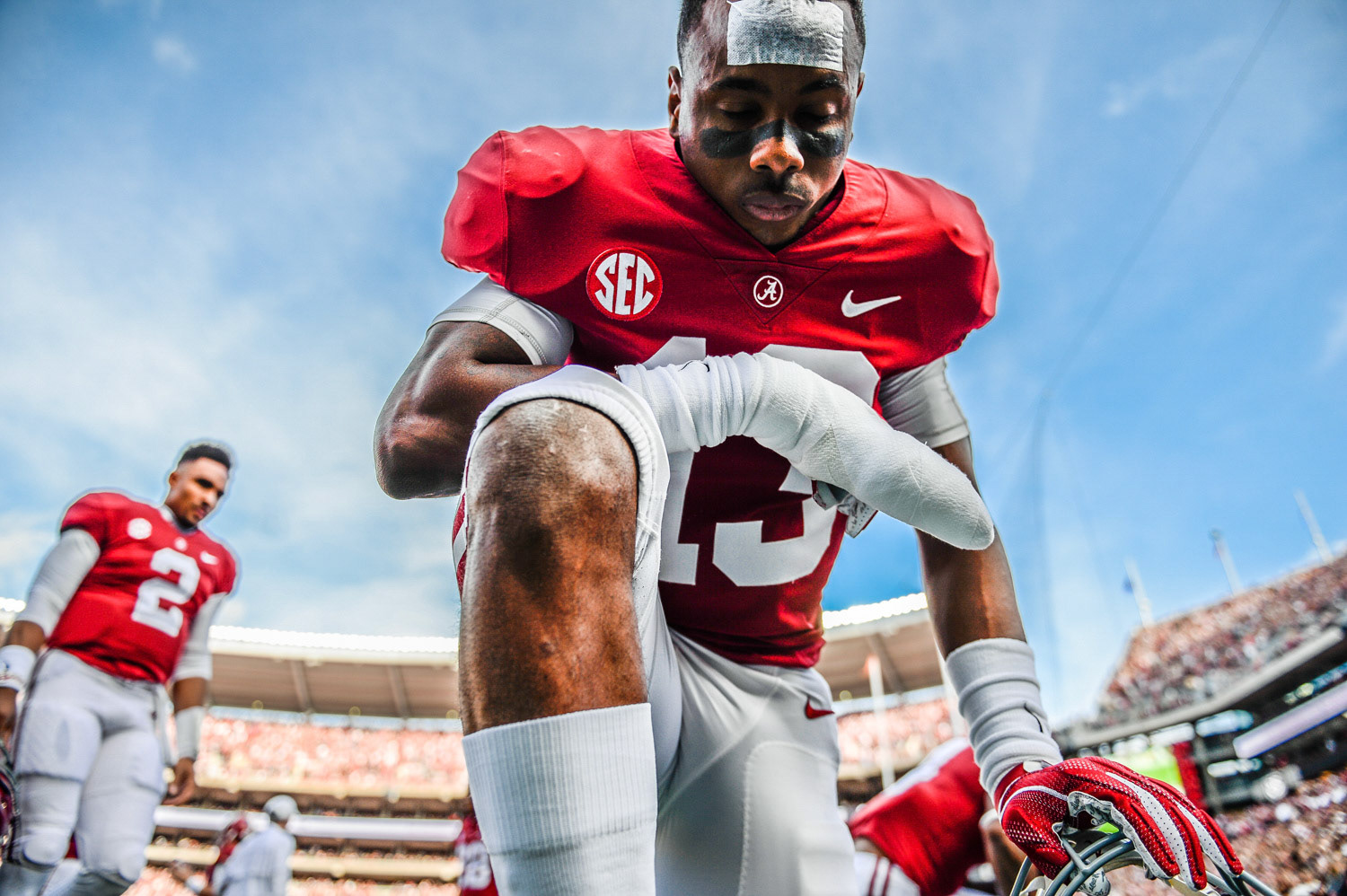 Alabama defensive back Nigel Knott (13) kneels to pray before the 2018 Iron Bowl on November 24, 2018, at Bryant-Denny Stadium in Tuscaloosa, Ala.