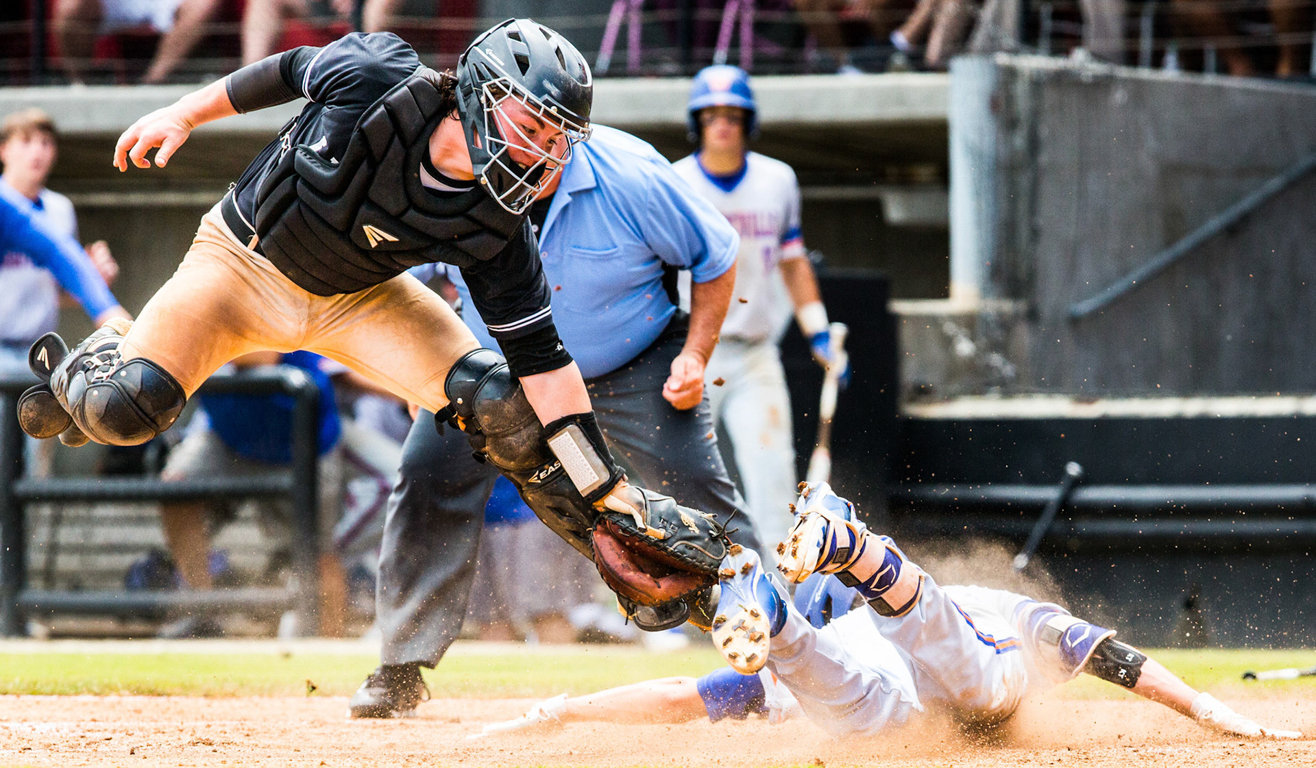 Ledford's Avery Cain, left, attempts a tag on Whiteville's Brooks Baldwin as he safely arrives at home for an inside-the-park home run during their game on Saturday, June 2, 2018, at Five County Stadium in Zebulon, North Carolina.