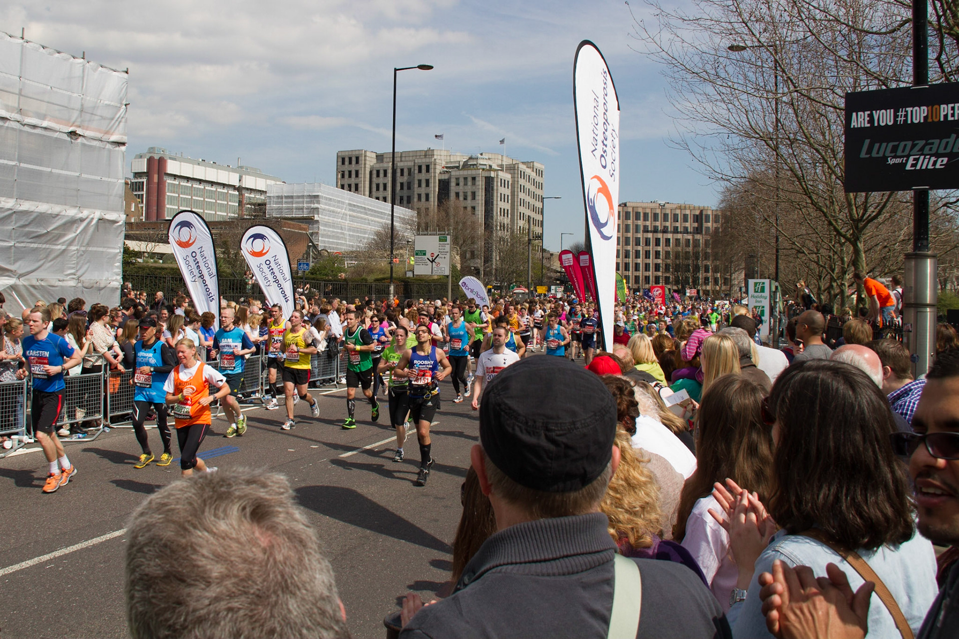 Runners passing the Tower of London at 22.5 miles