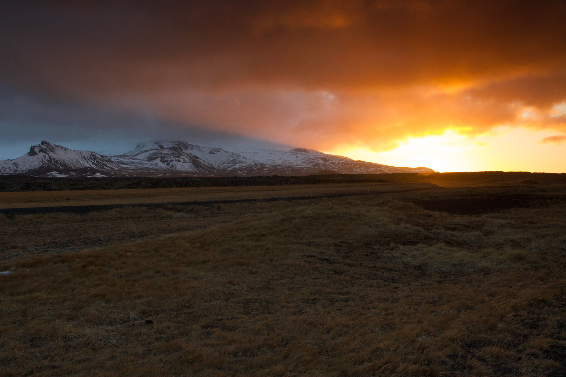Sunrise over Snaefellsjokull (in the cloud)