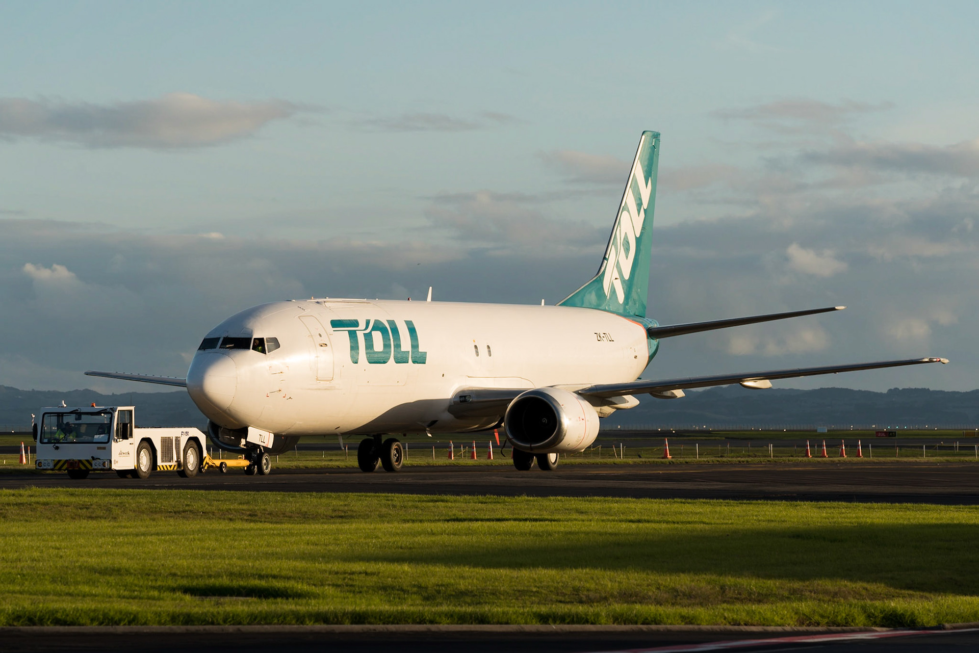 Toll Boeing 737-400 ZK-TLL under tow at Auckland.