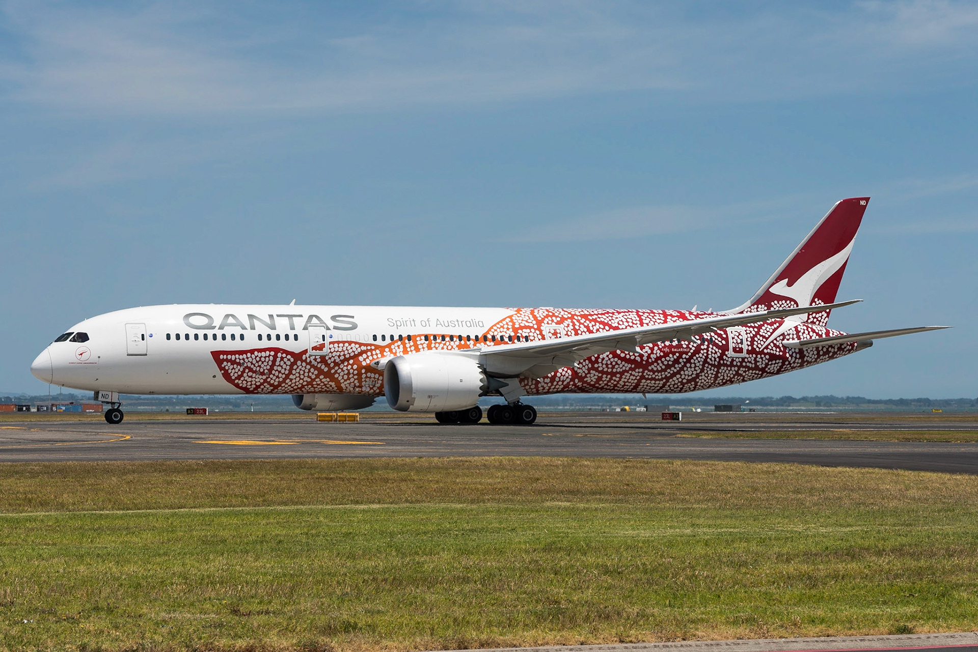Qantas Boeing 787-9 VH-ZND departing Auckland, wearing the Yam Dreaming / Emily livery.